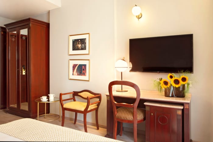 a room with a tv and chairs