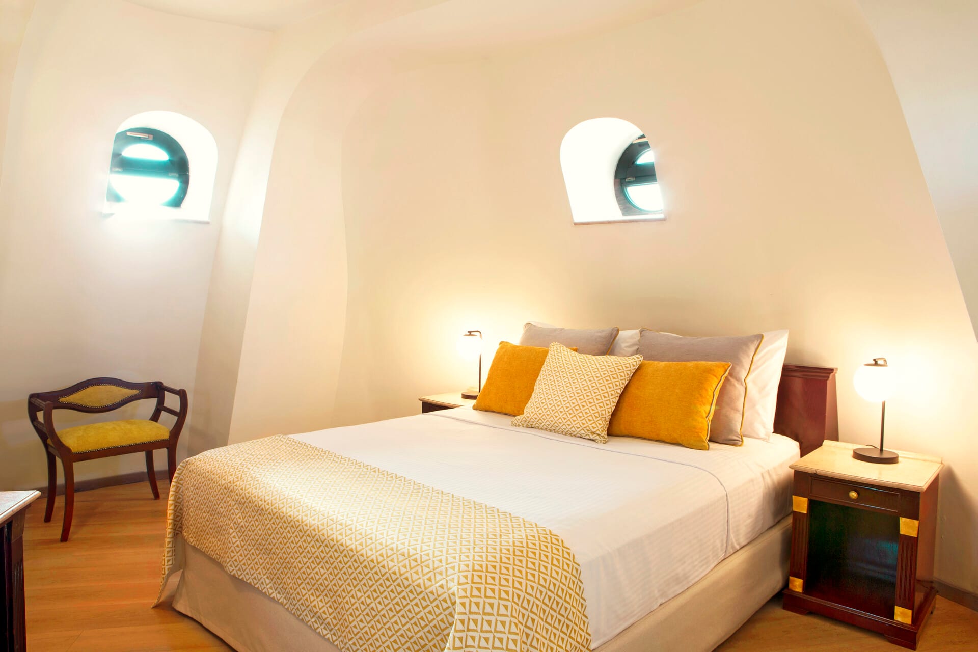 a bed with yellow pillows