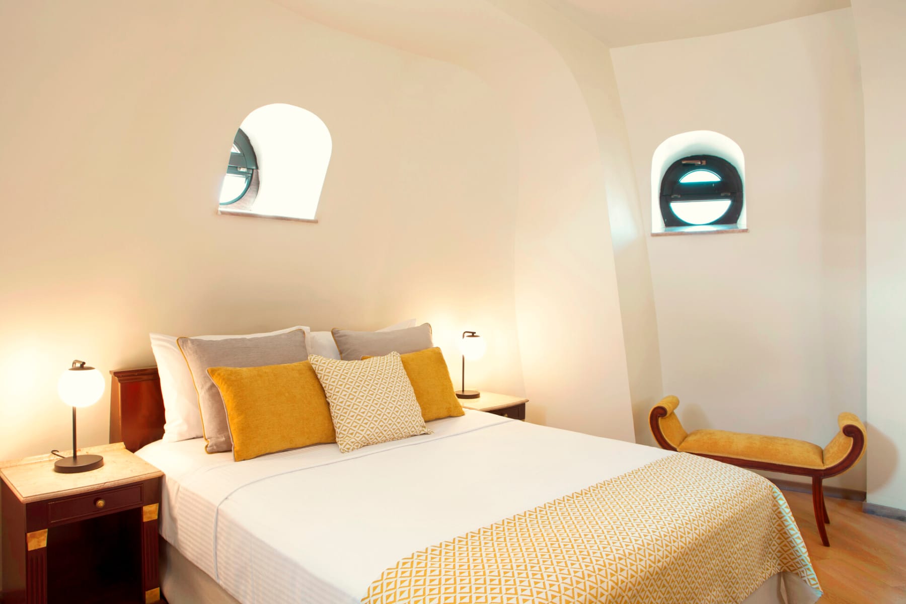 a bed with a white bed spread