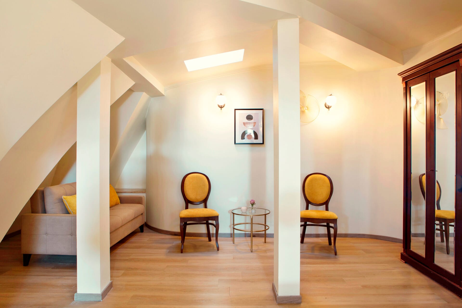 a room with a staircase and chairs