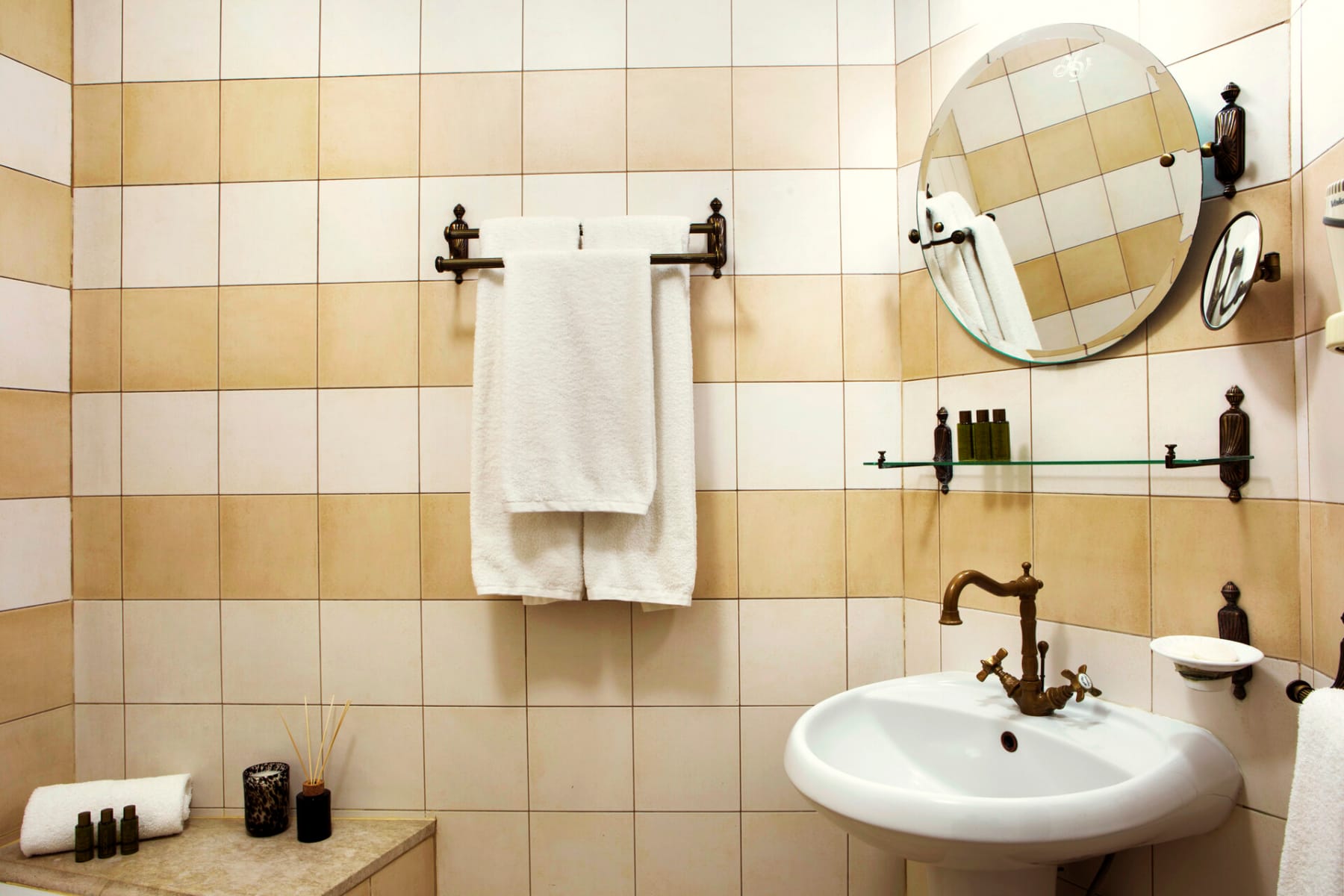 a bathroom with a mirror and sink
