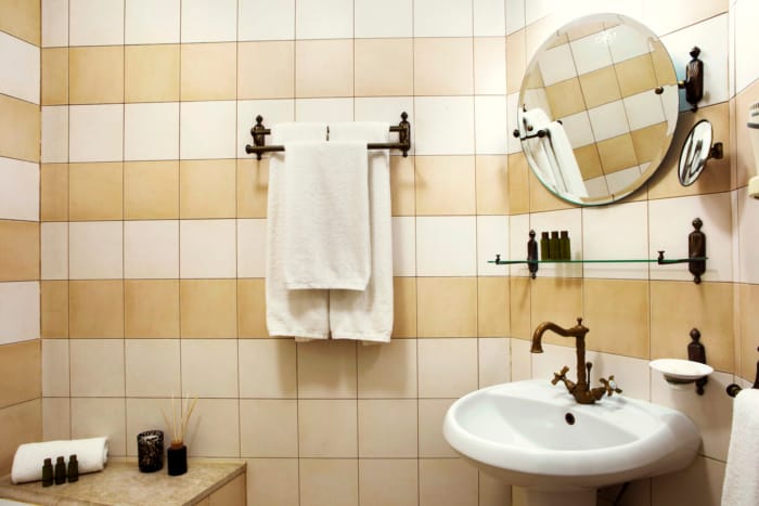 a bathroom with a mirror and sink