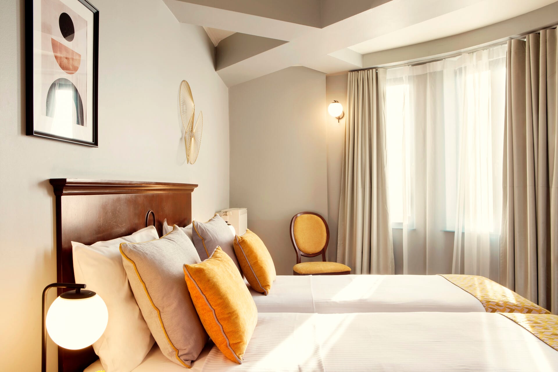 a bedroom with a bed and a lamp