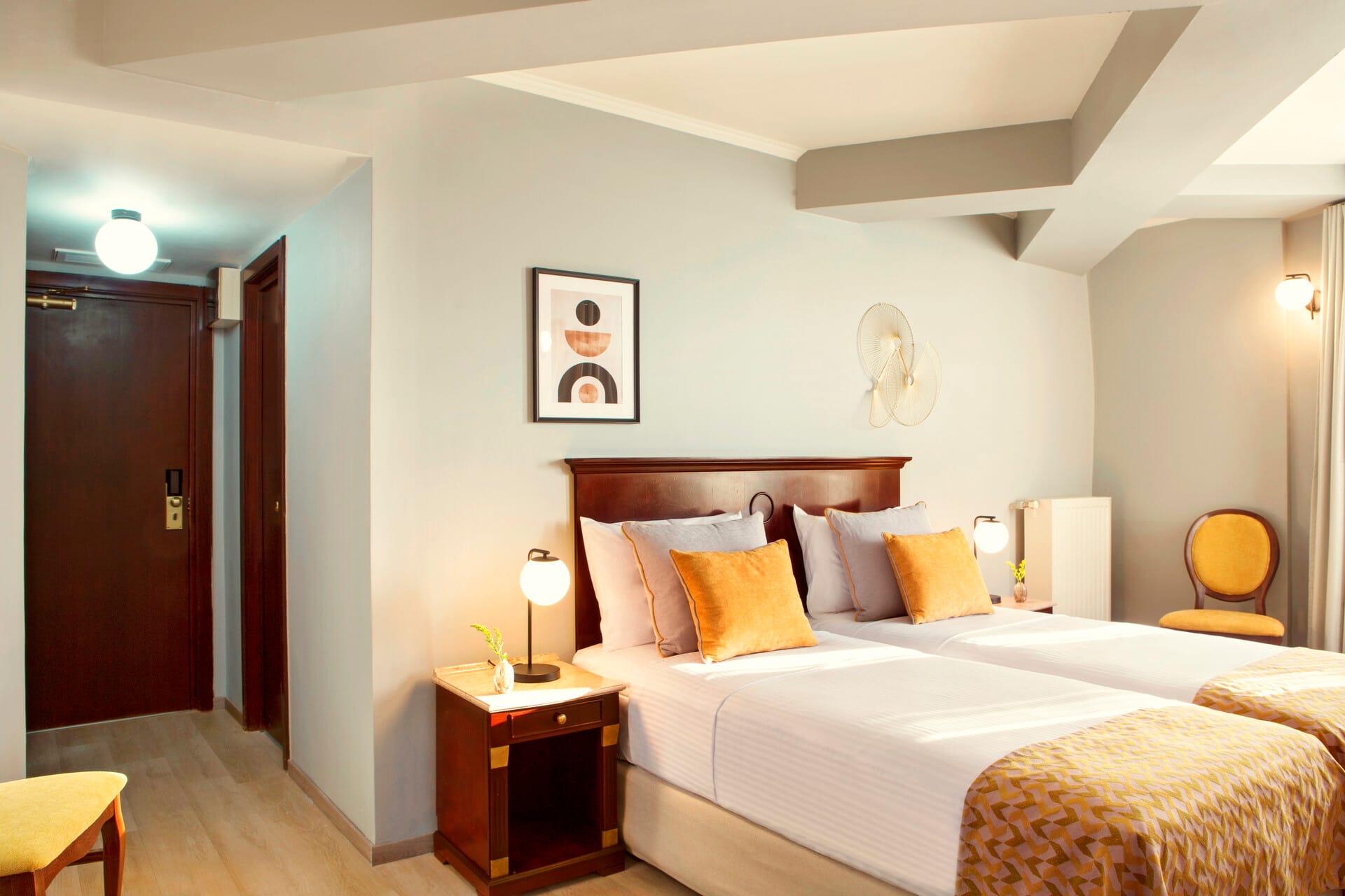 a bedroom with a bed and a chair