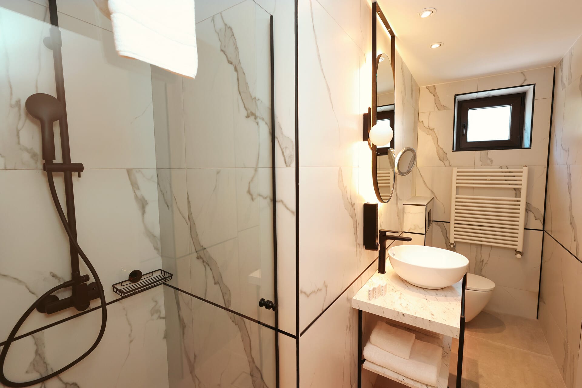 a bathroom with a shower and toilet