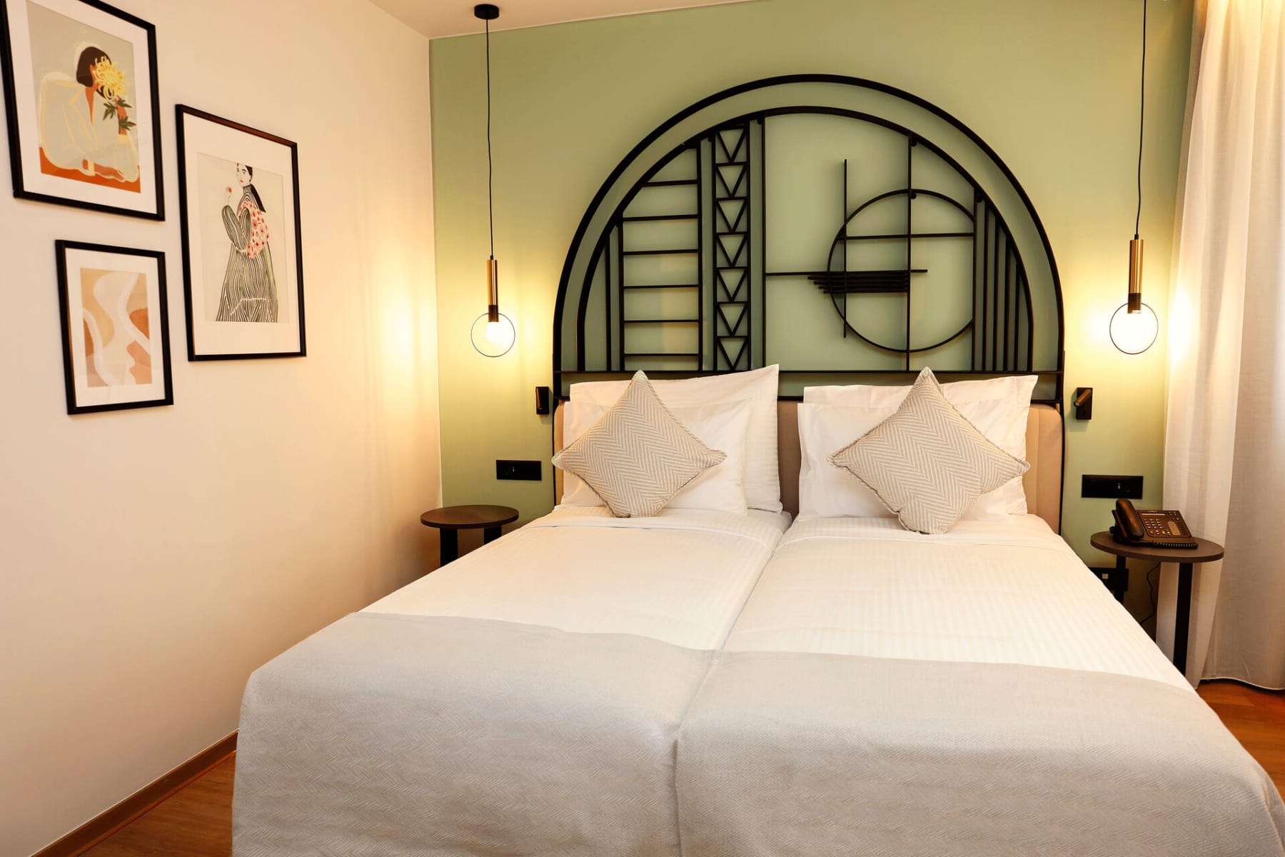 a bed with a mirror above it