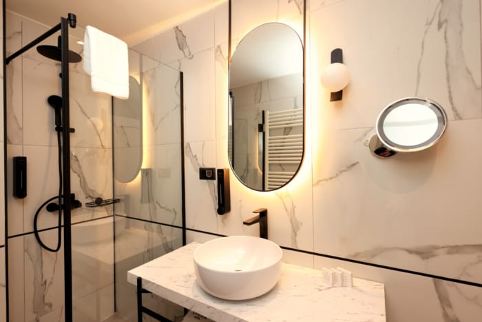 a bathroom with a sink and a mirror