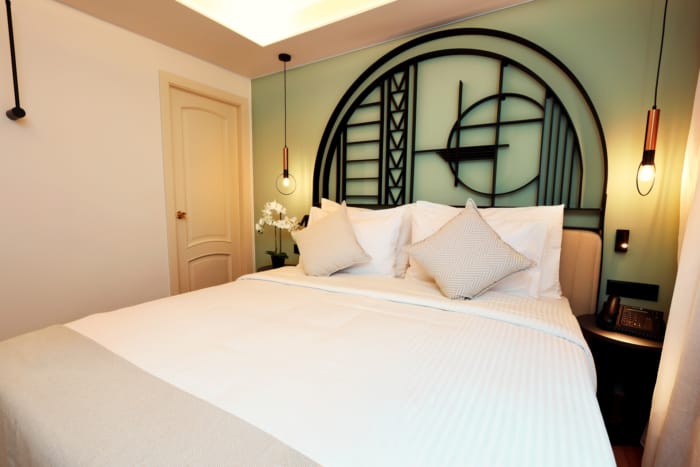 a bed with white sheets
