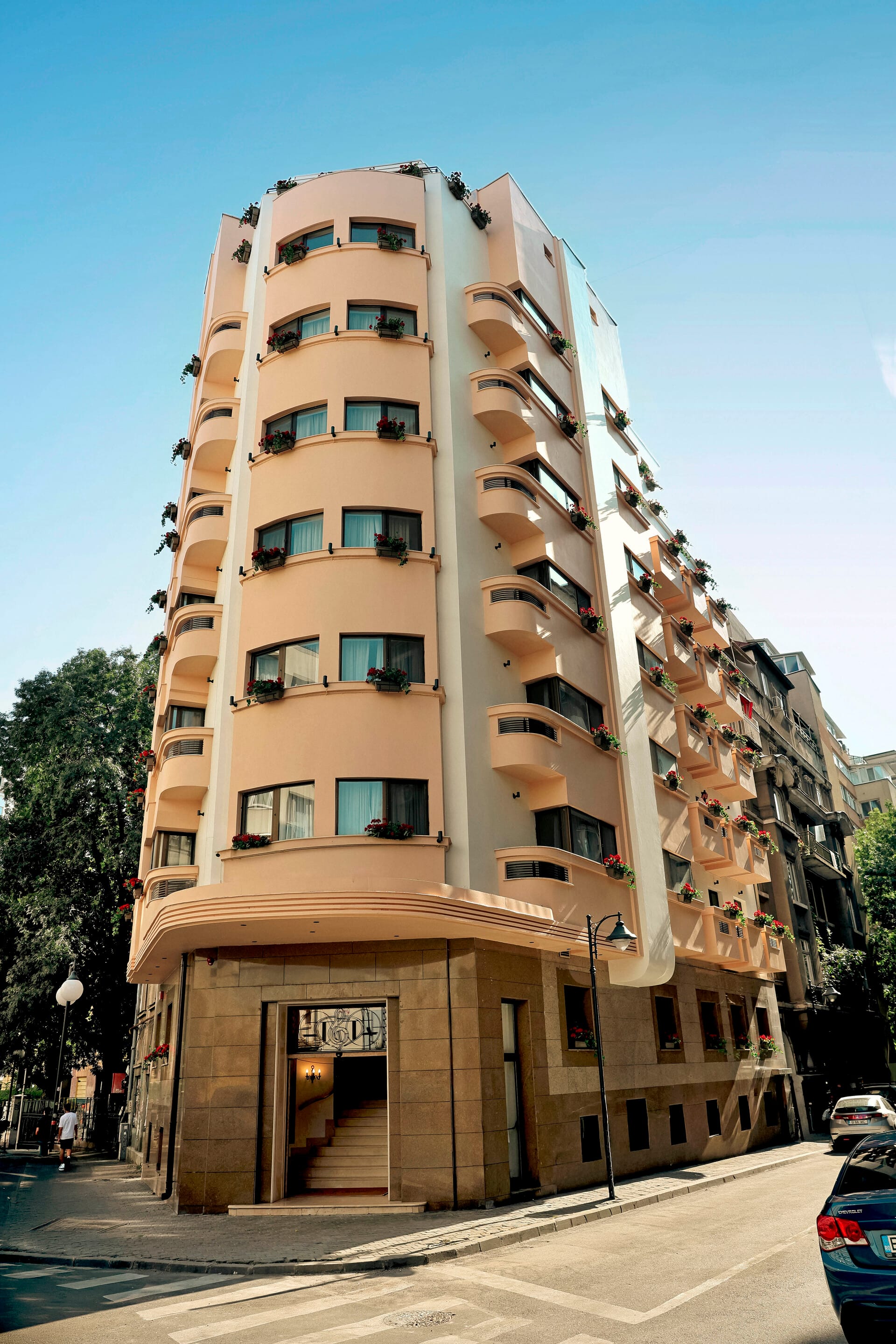 a tall building with a street and cars