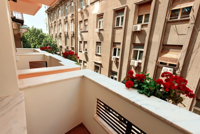 a balcony with flowers on it