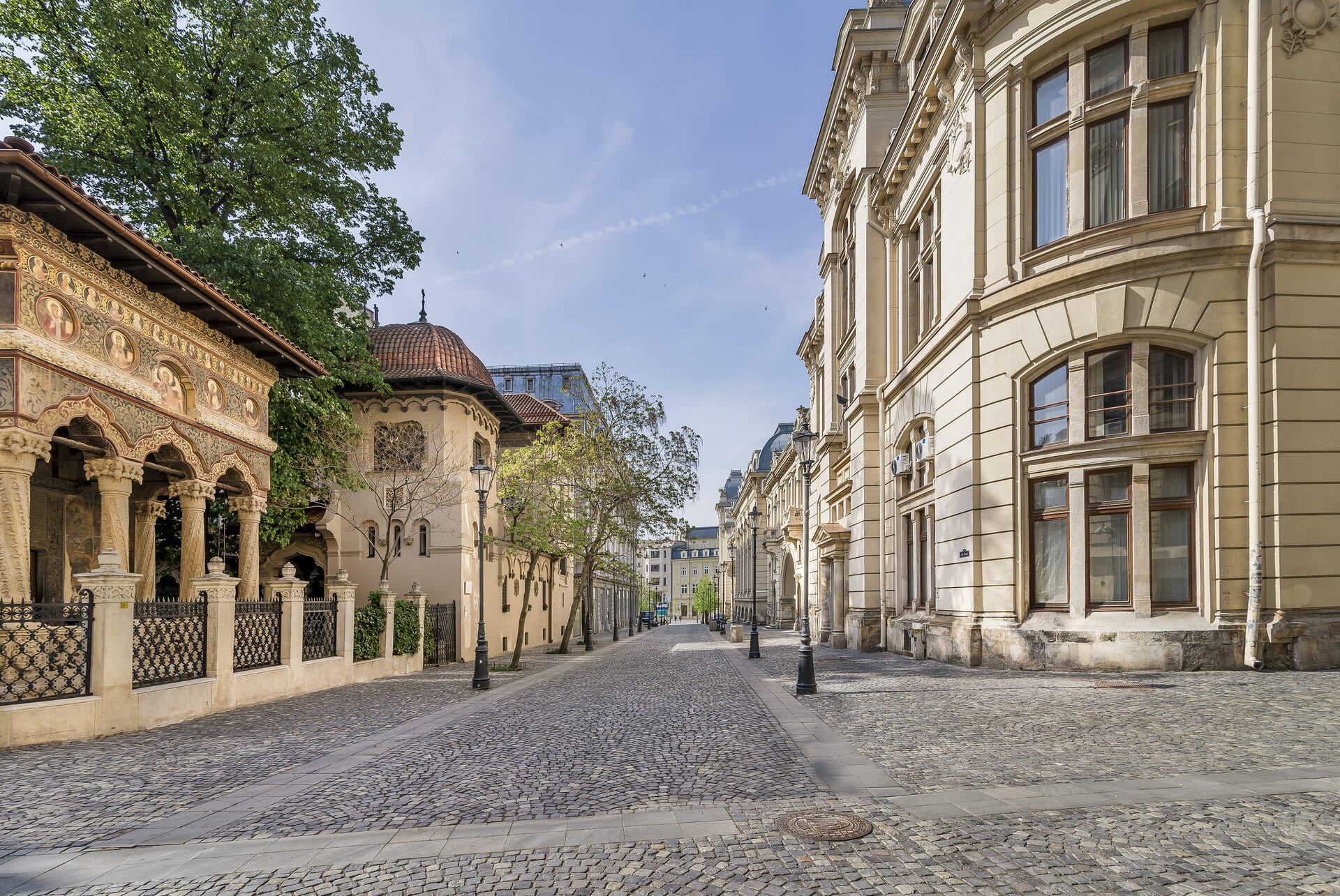 a cobblestone street with buildings on either side of it