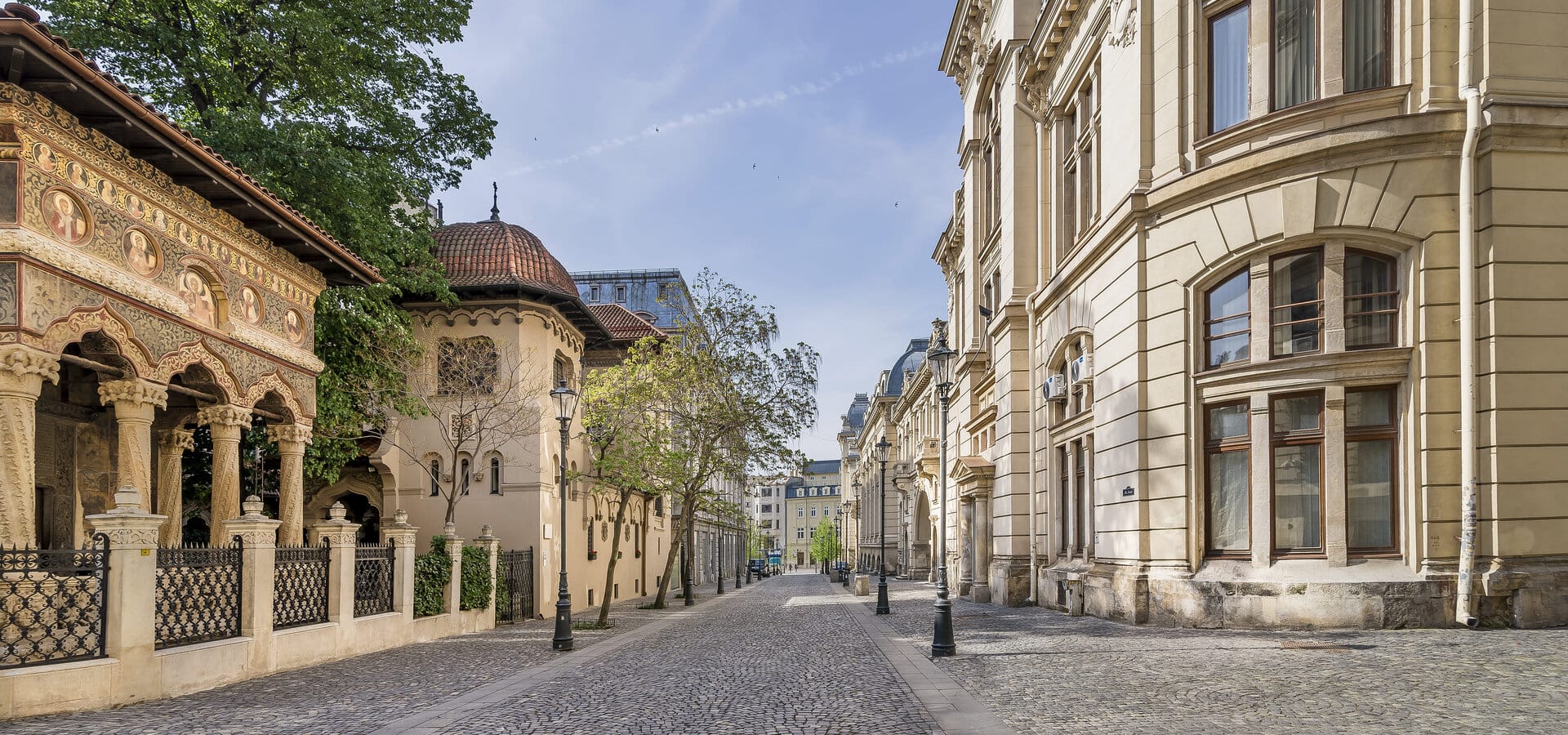 a cobblestone street with buildings on either side of it