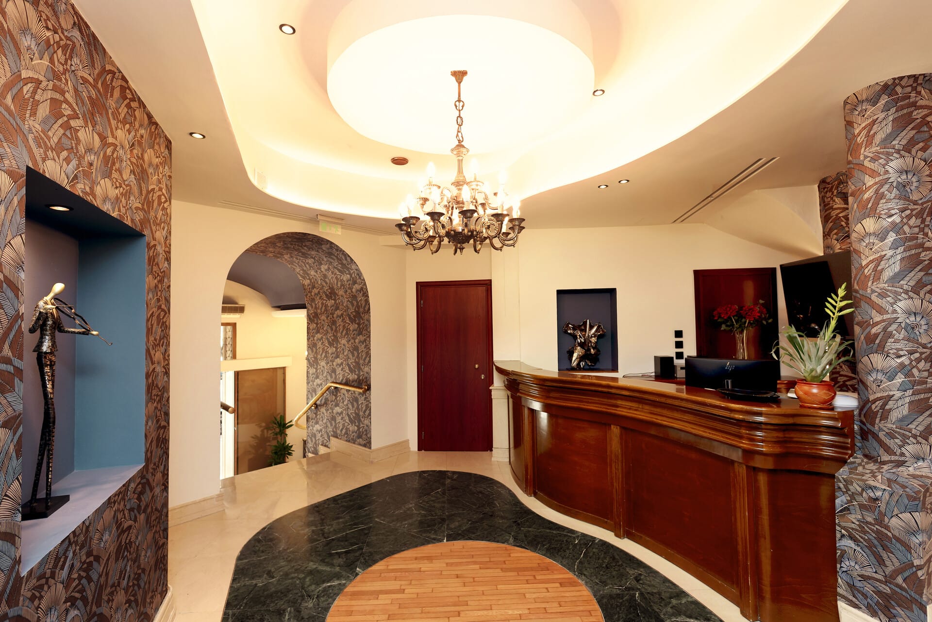 a large room with a chandelier and a desk