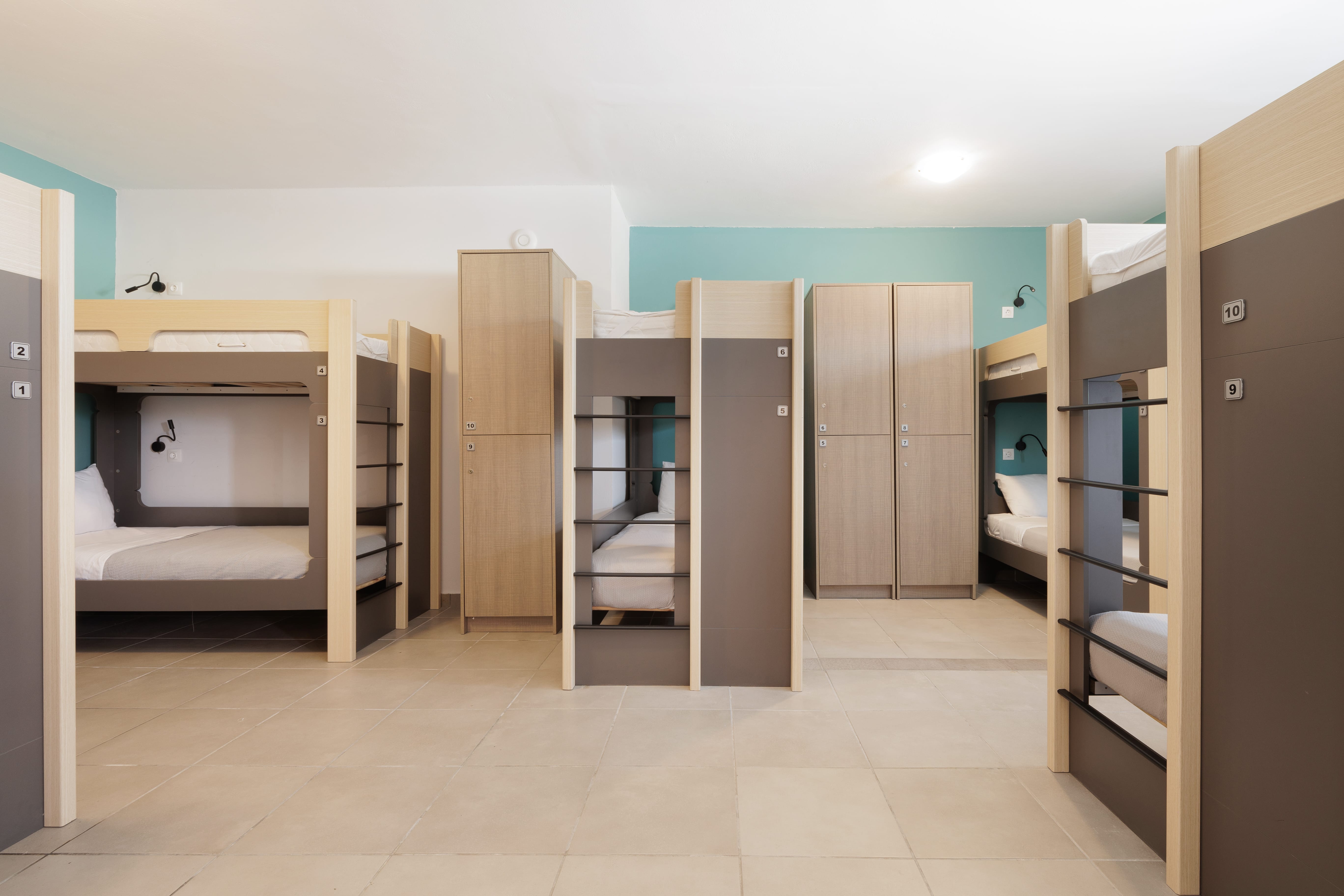 a room with shelves and a bed