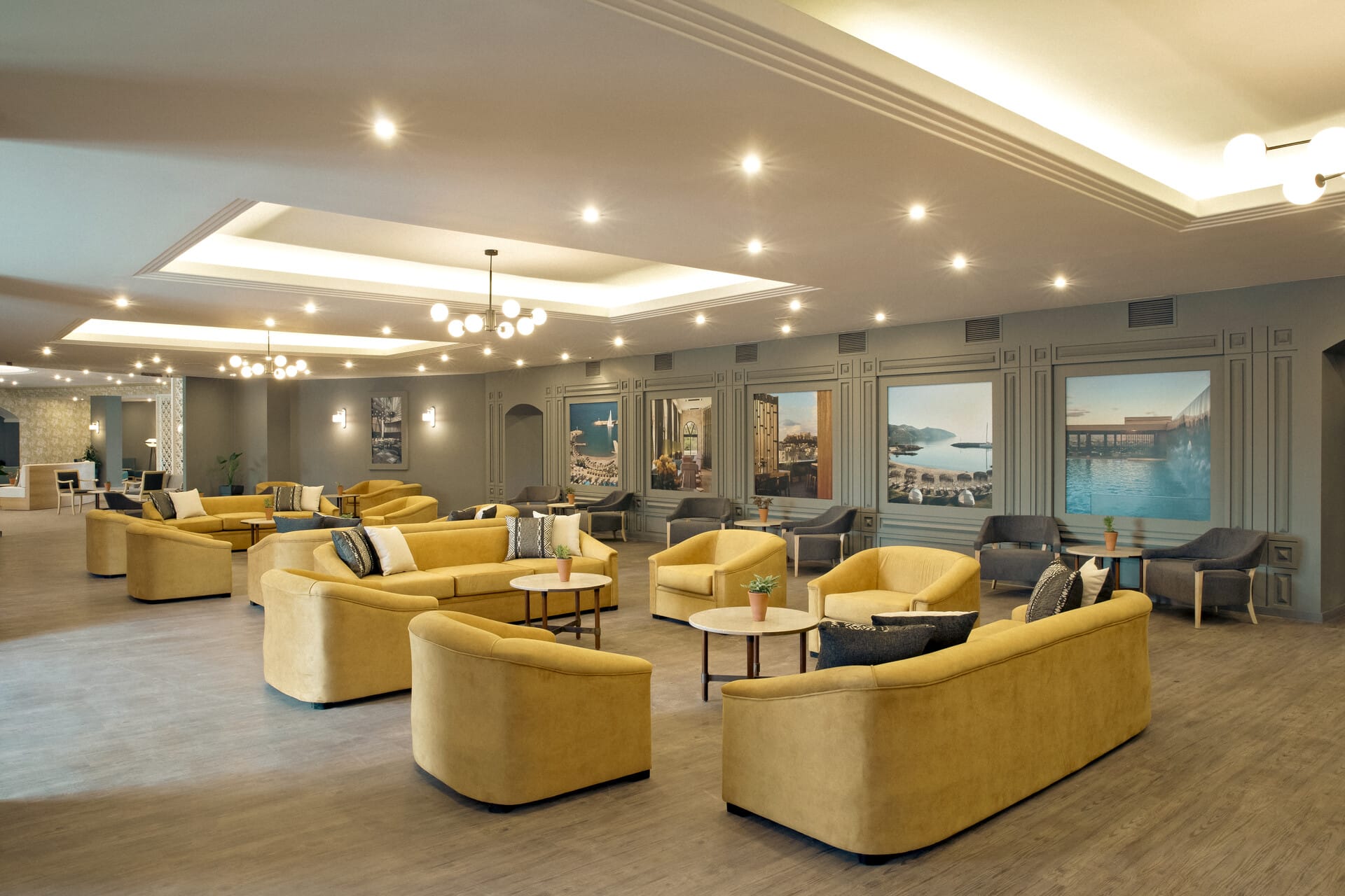 a room with yellow couches and a large window