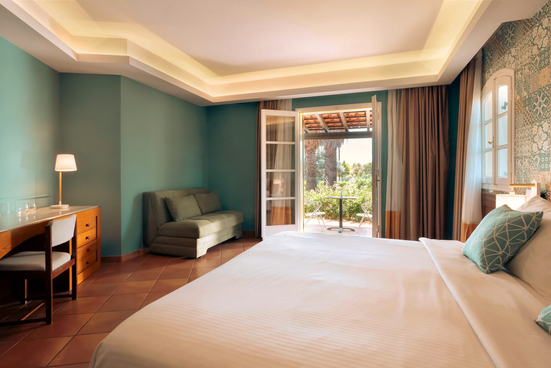 a bedroom with a large window