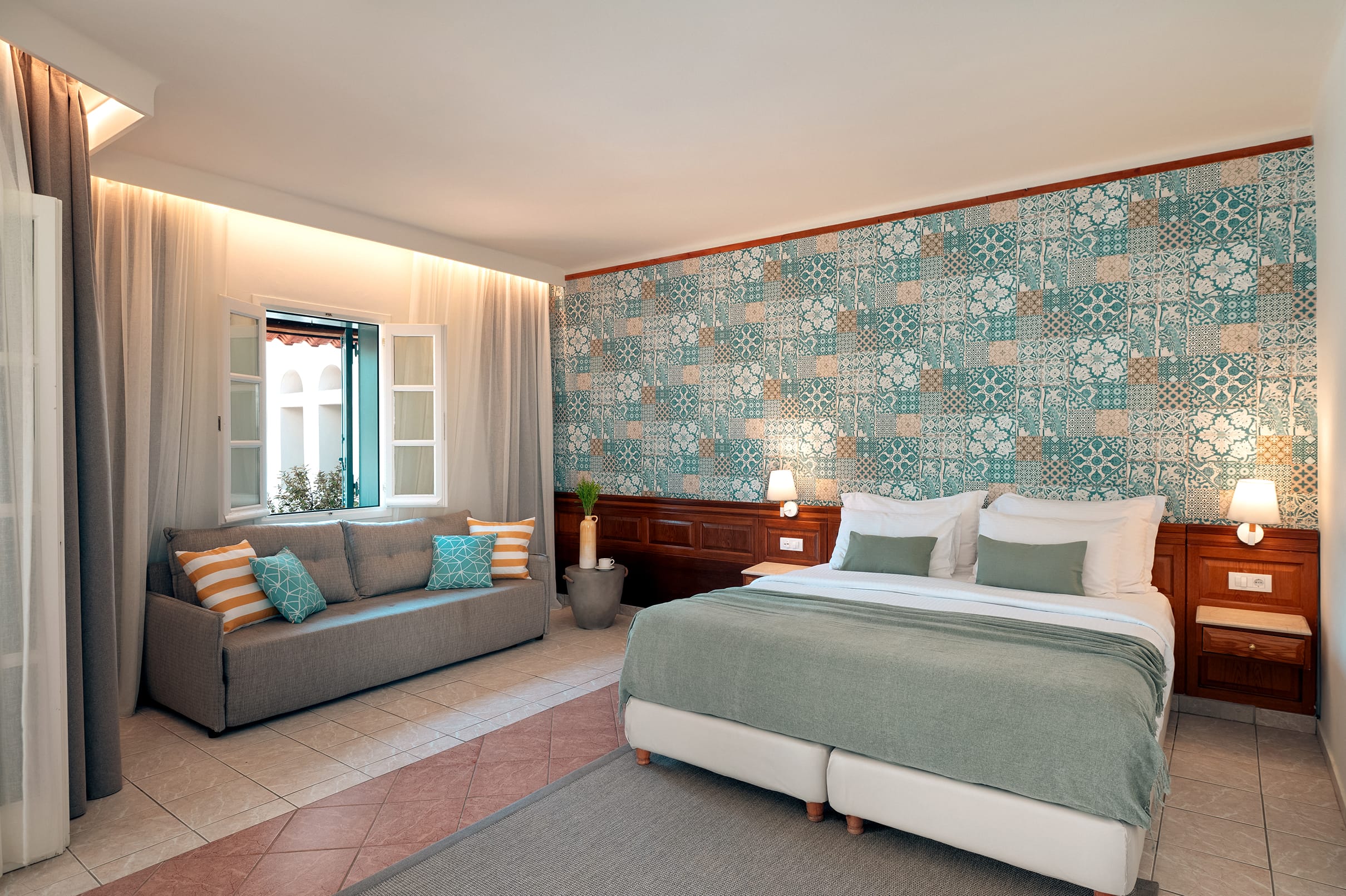 a bedroom with a bed and couch