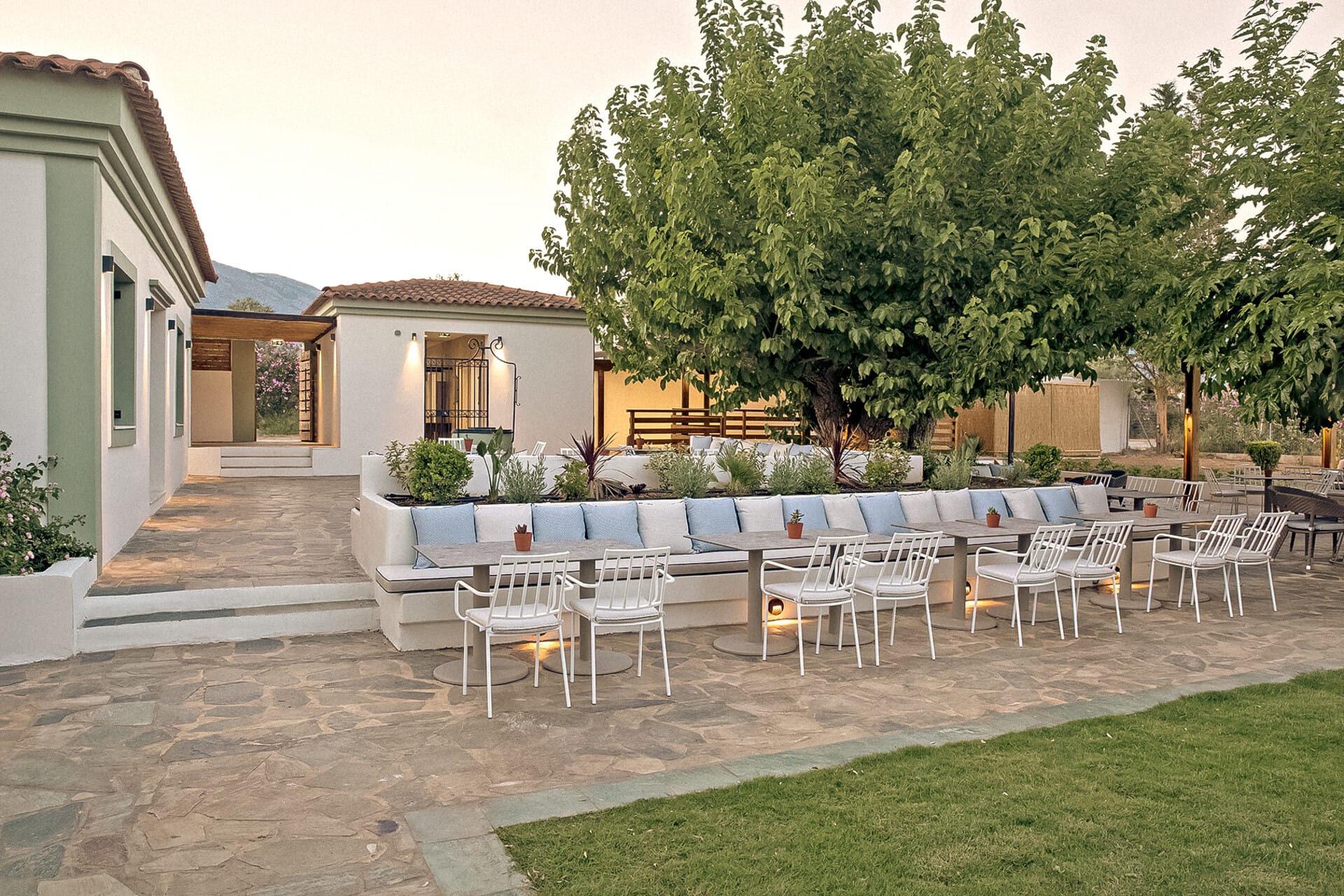 a backyard with a table and chairs