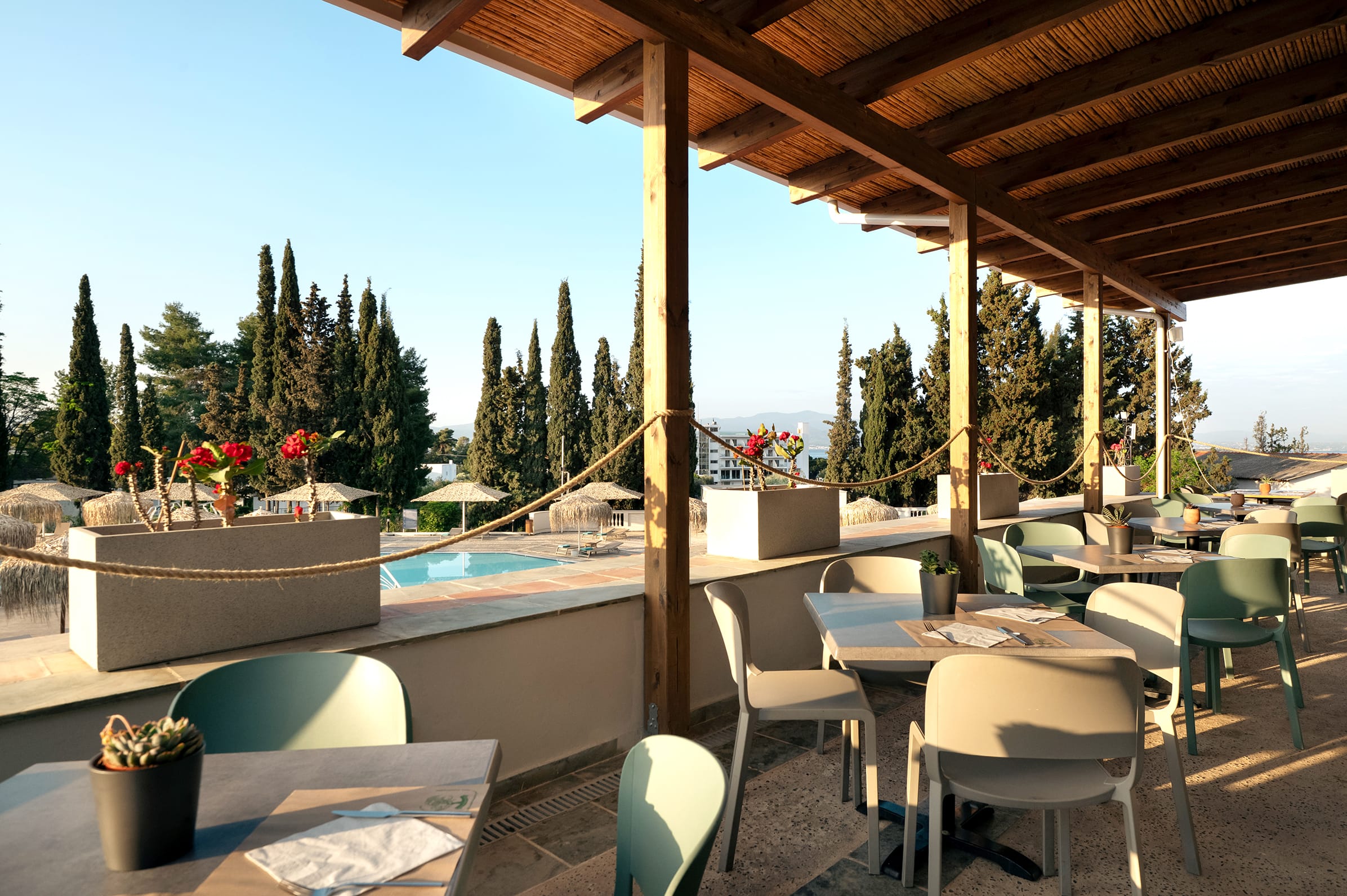 a pool with chairs and tables