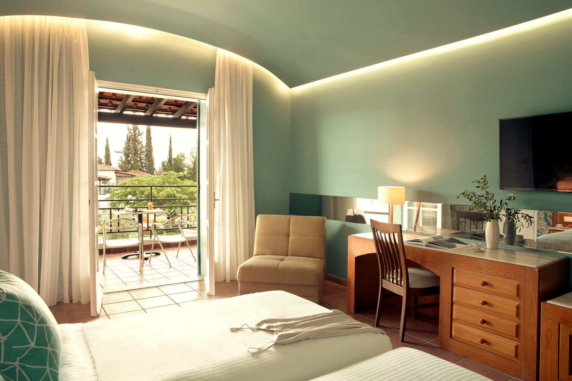 a room with a desk and chairs