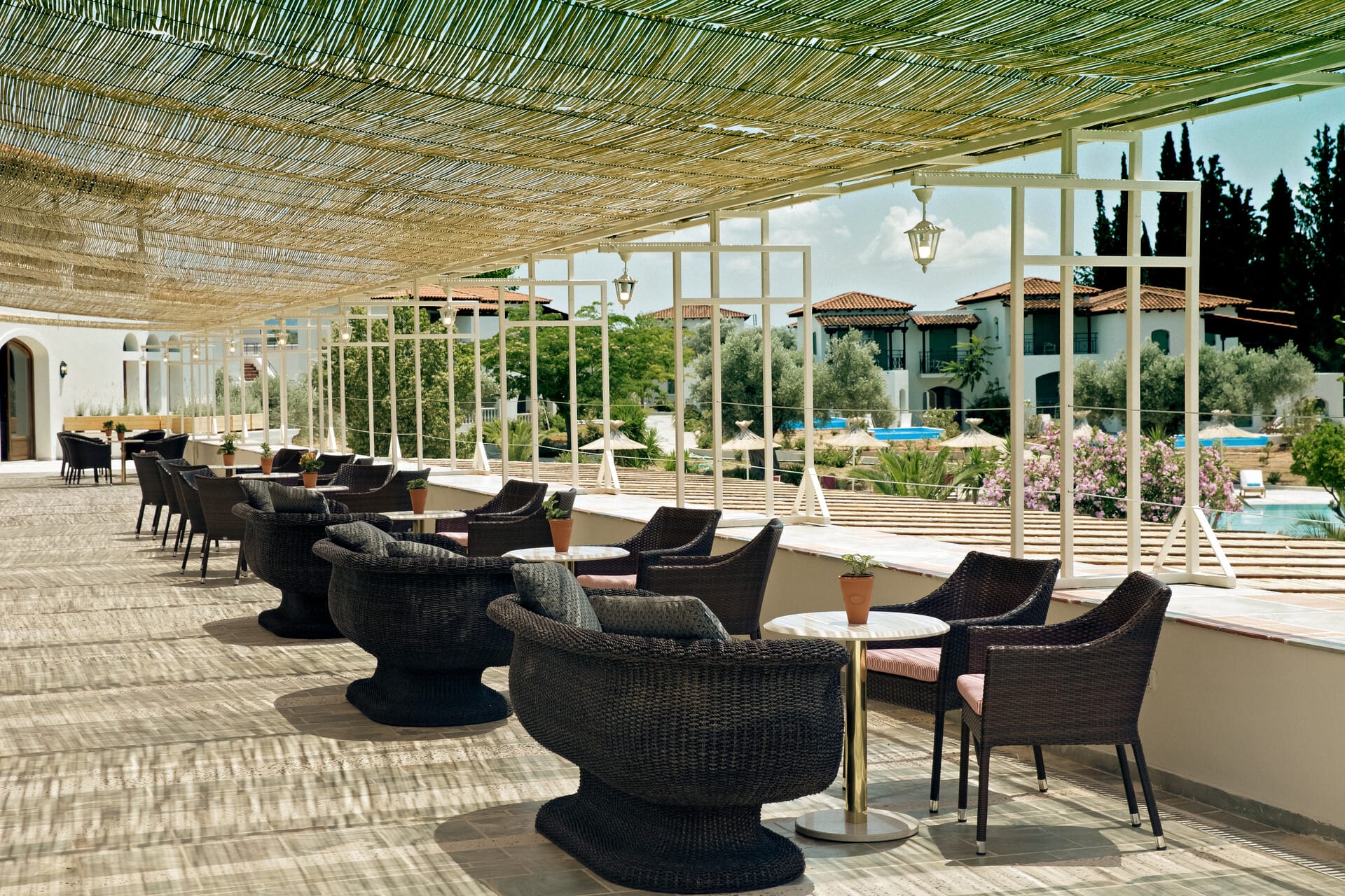 a patio with tables and chairs