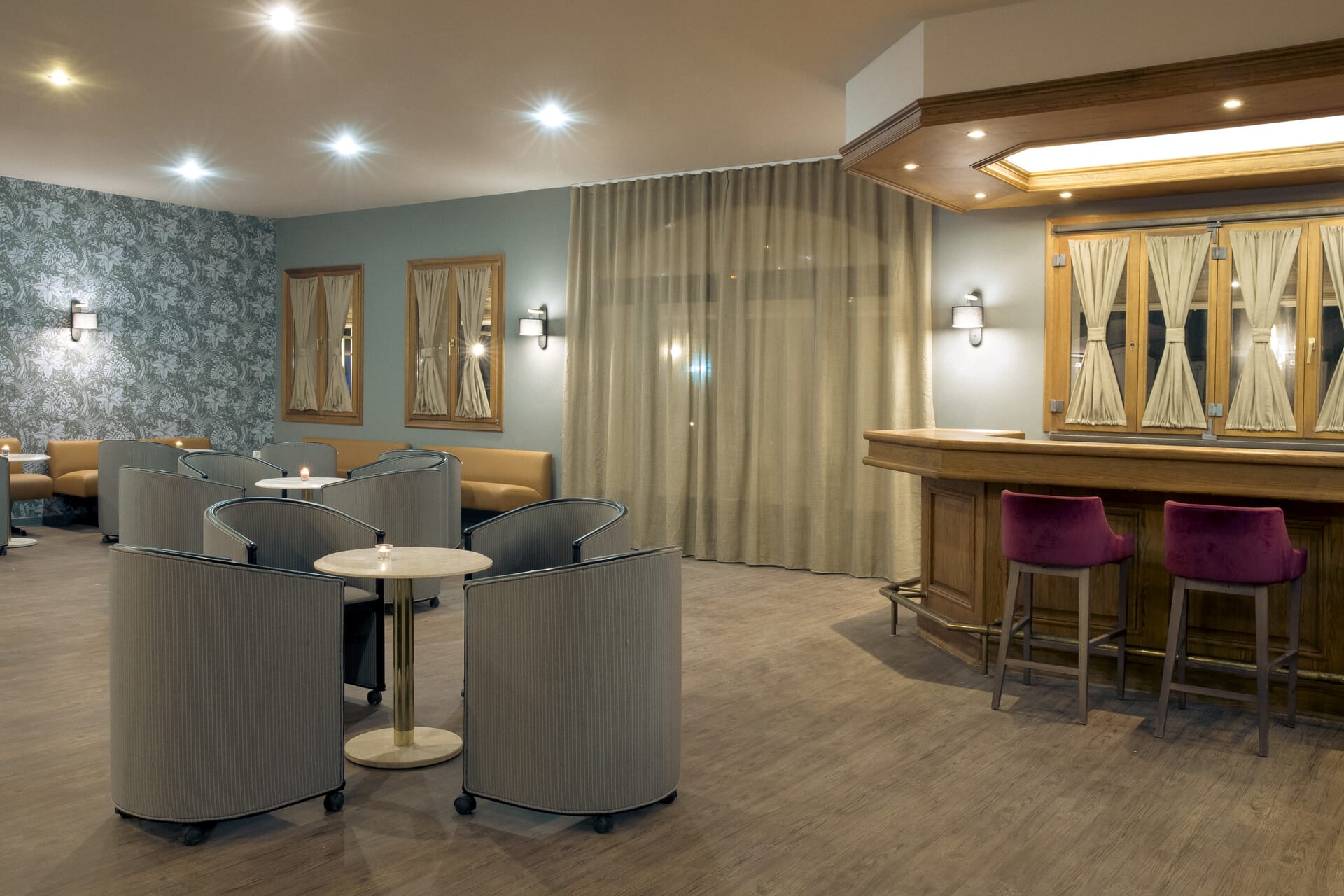 a room with a table chairs and a couch