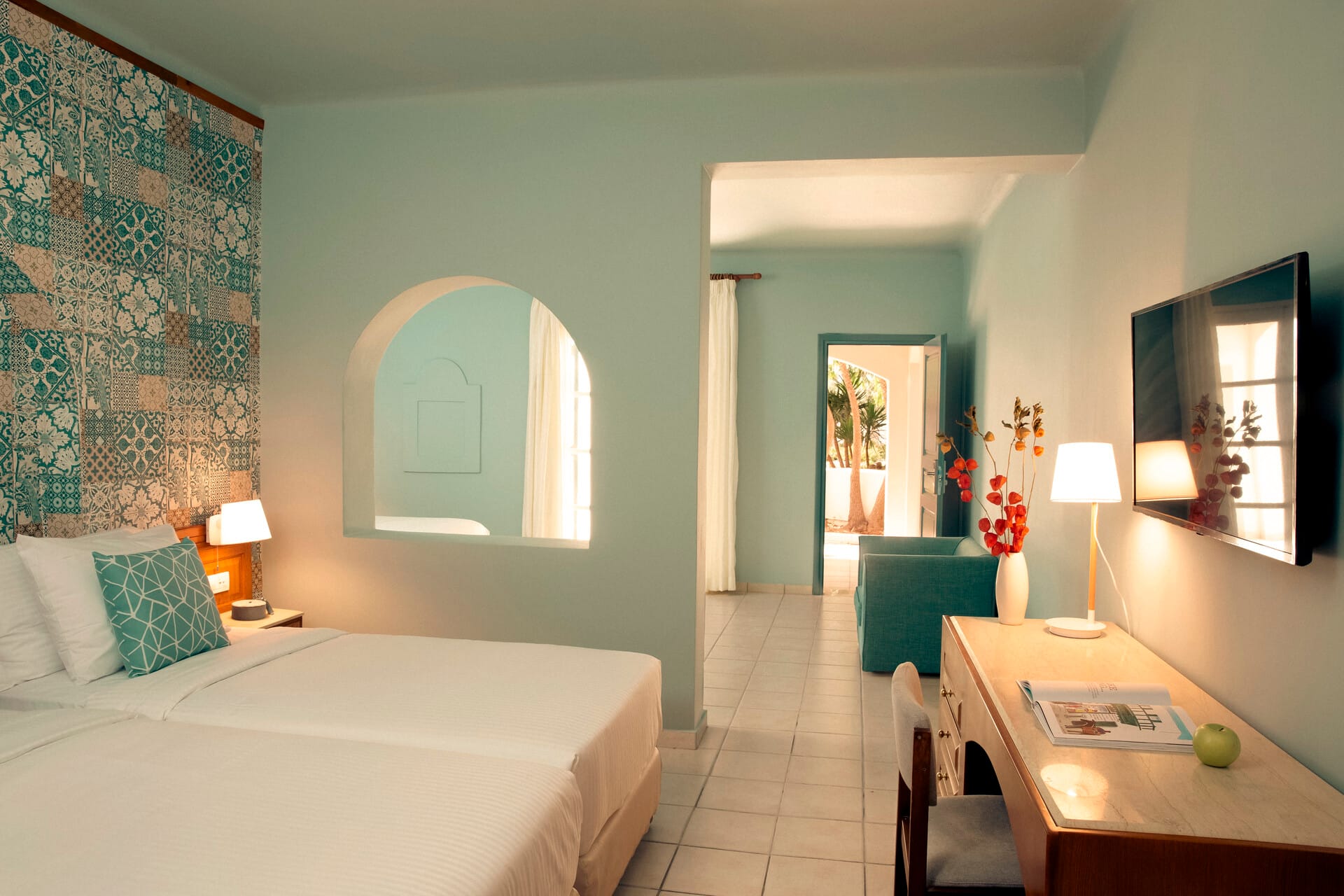 a bedroom with a bed and a mirror