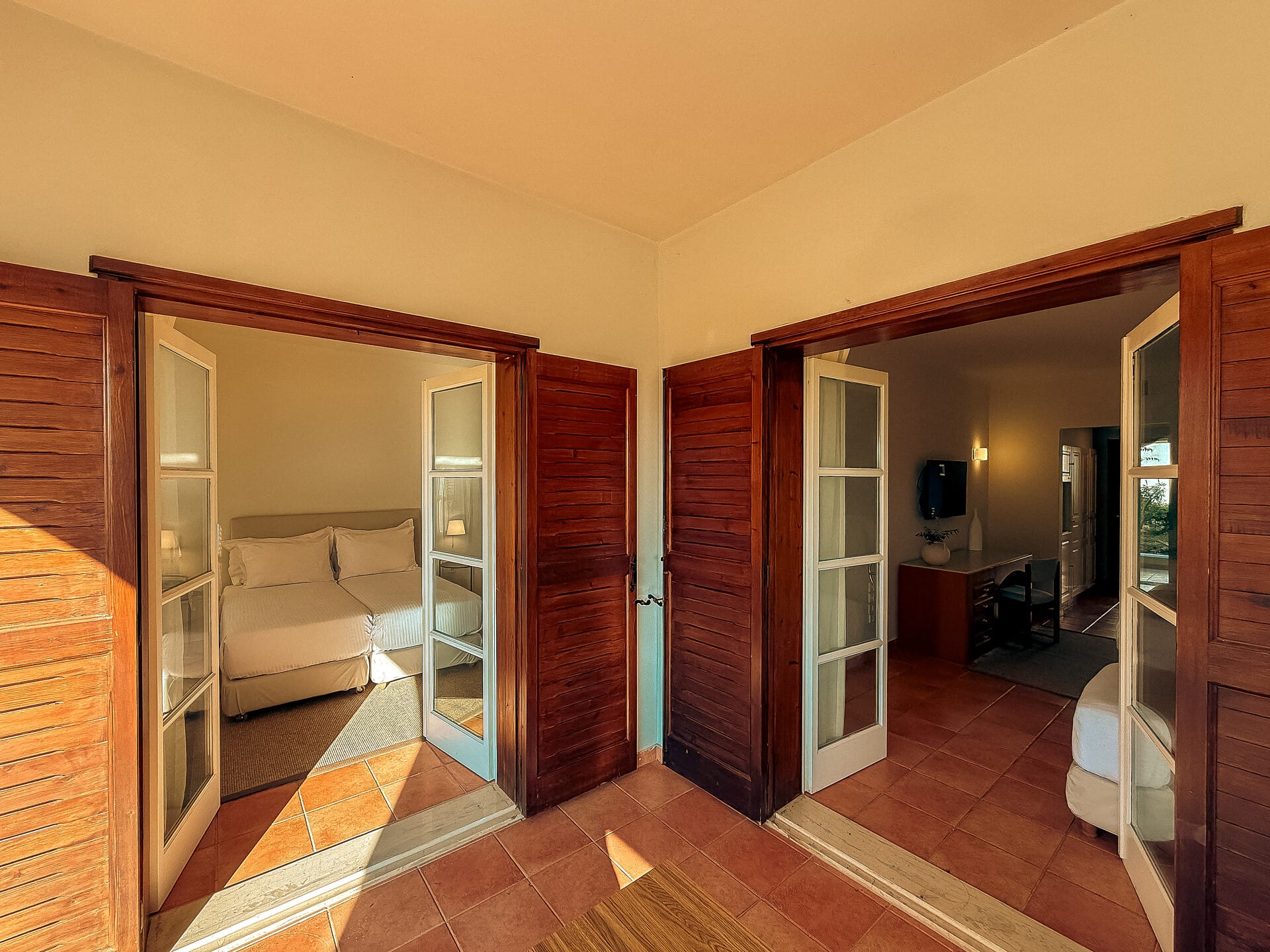 a room with a couch and a door