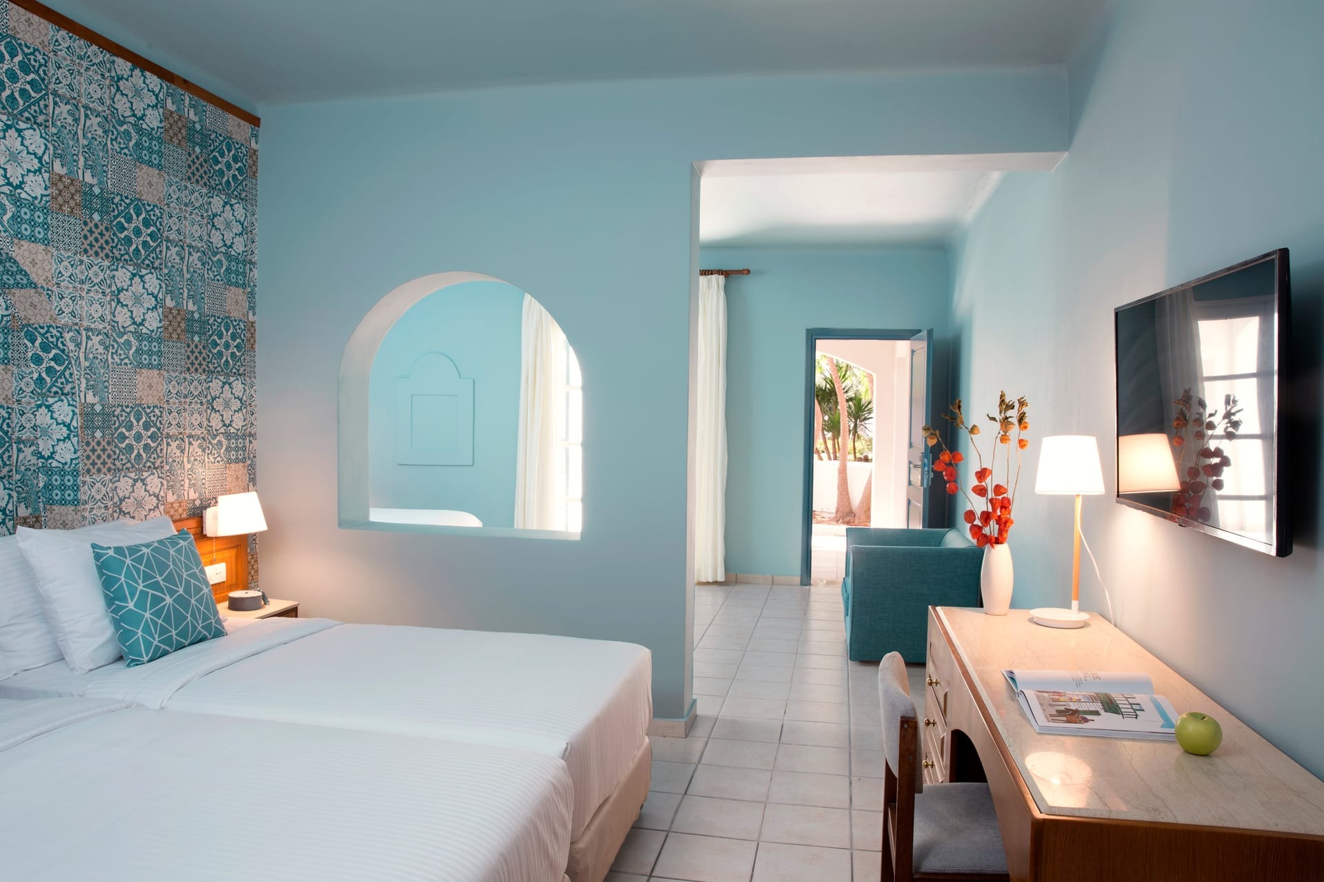 a bedroom with a bed and a desk