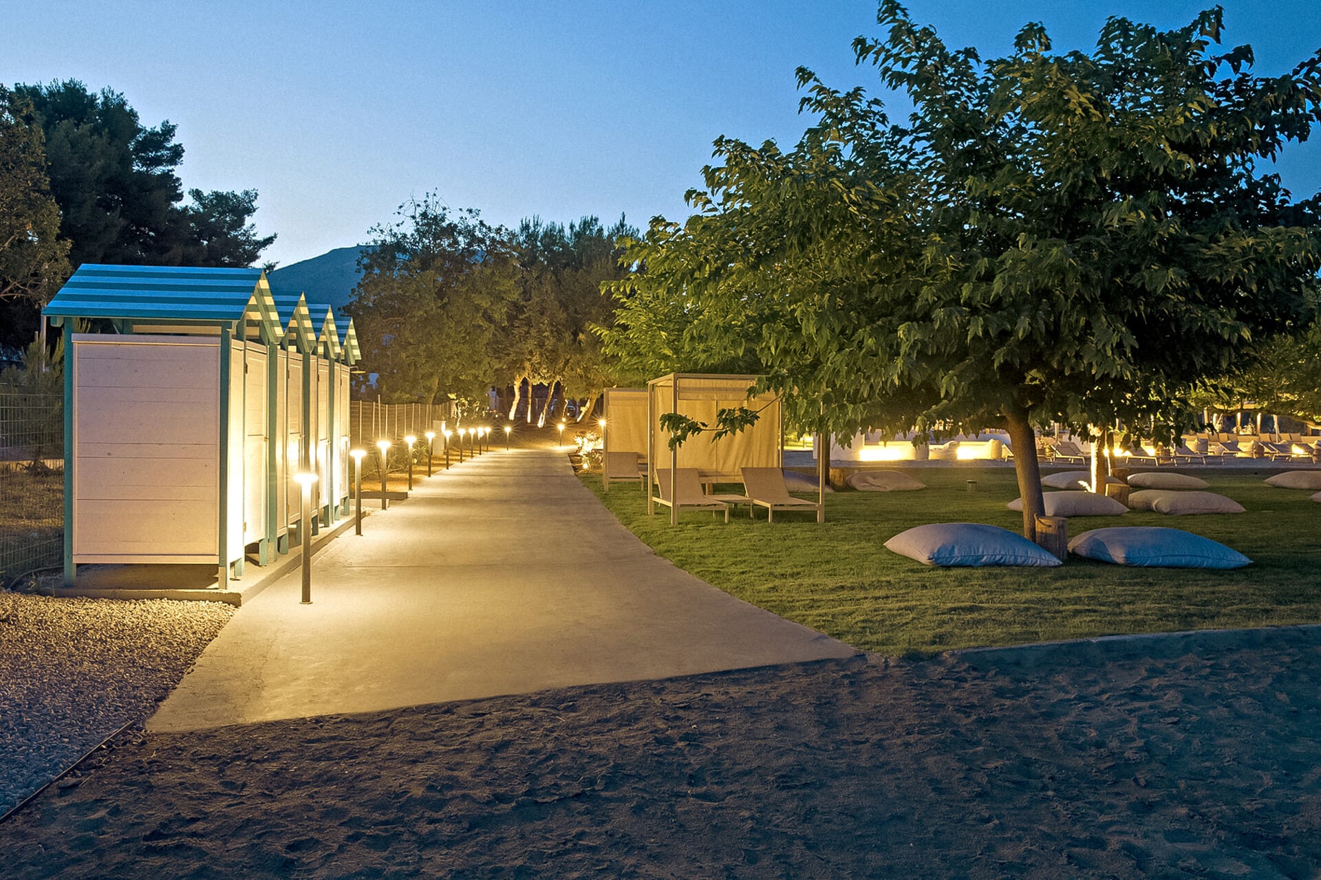 a building with a pool and trees