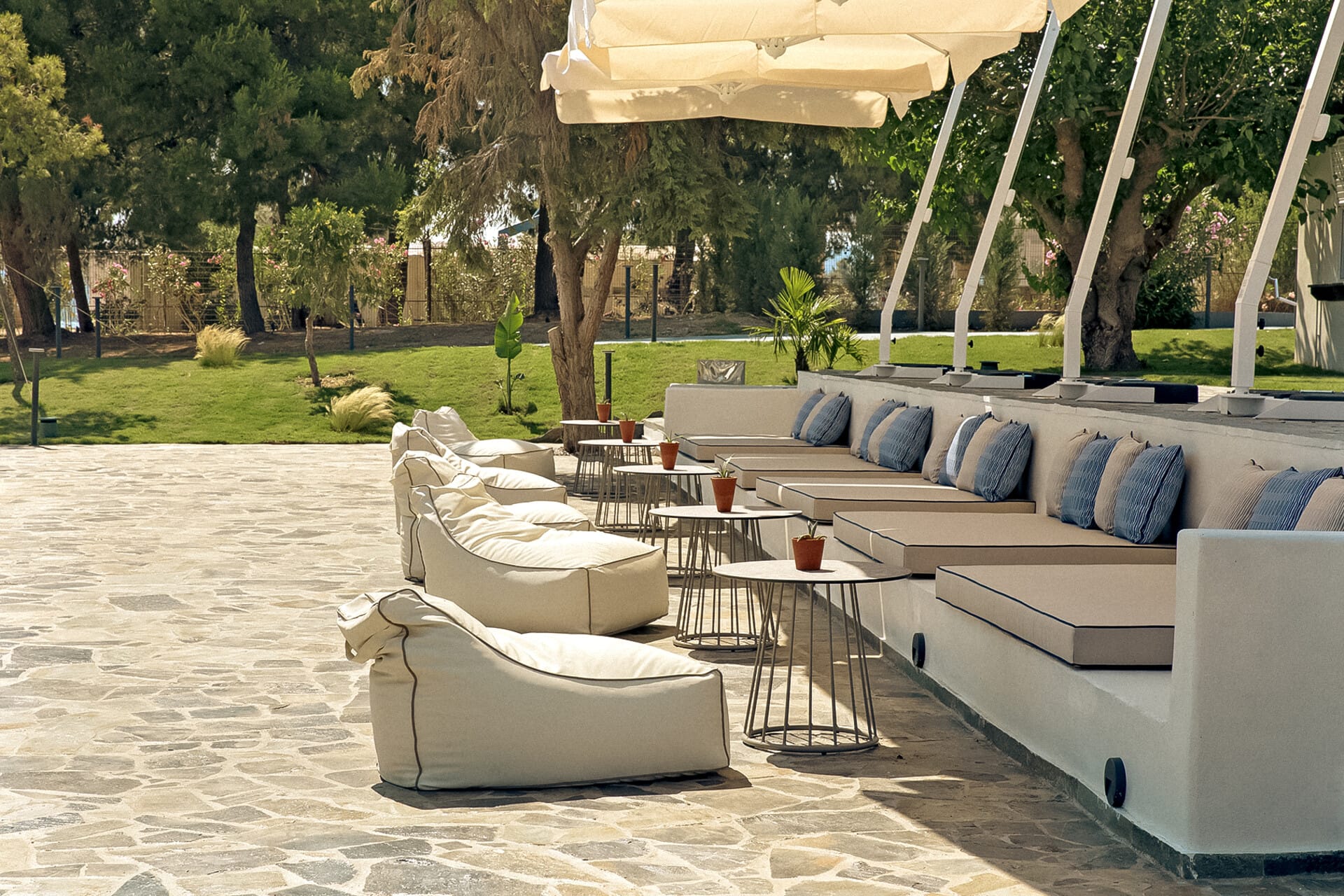 a lounge area with a table and chairs and a gazebo