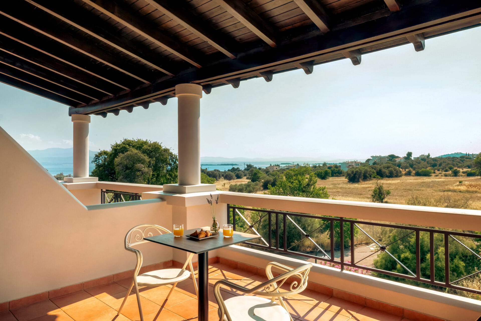 a table and chairs on a balcony