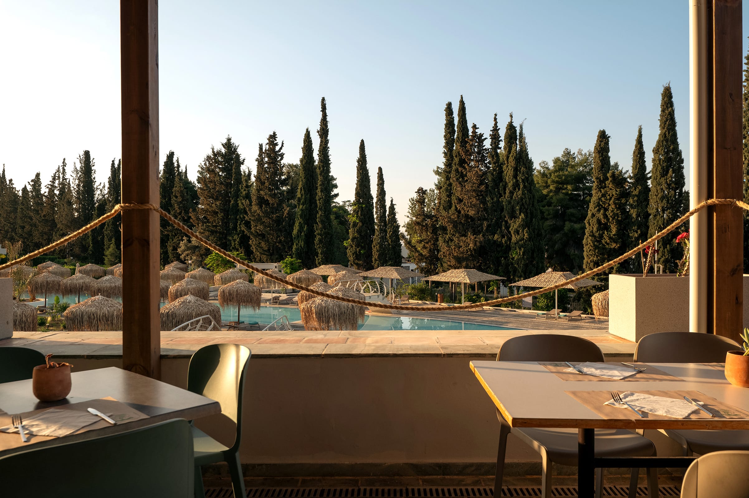 a pool with tables and chairs