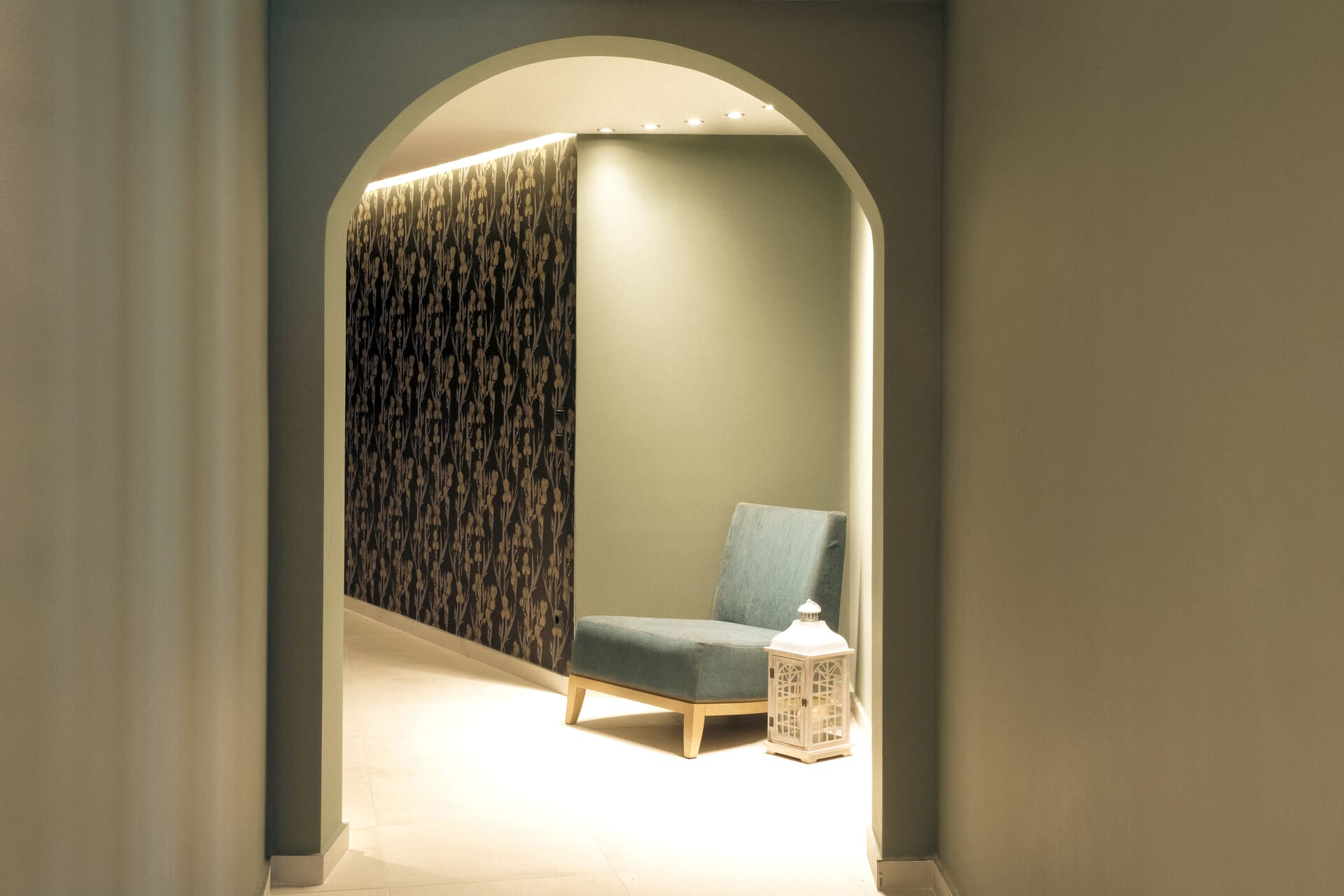 a room with a chair and a bottle of water