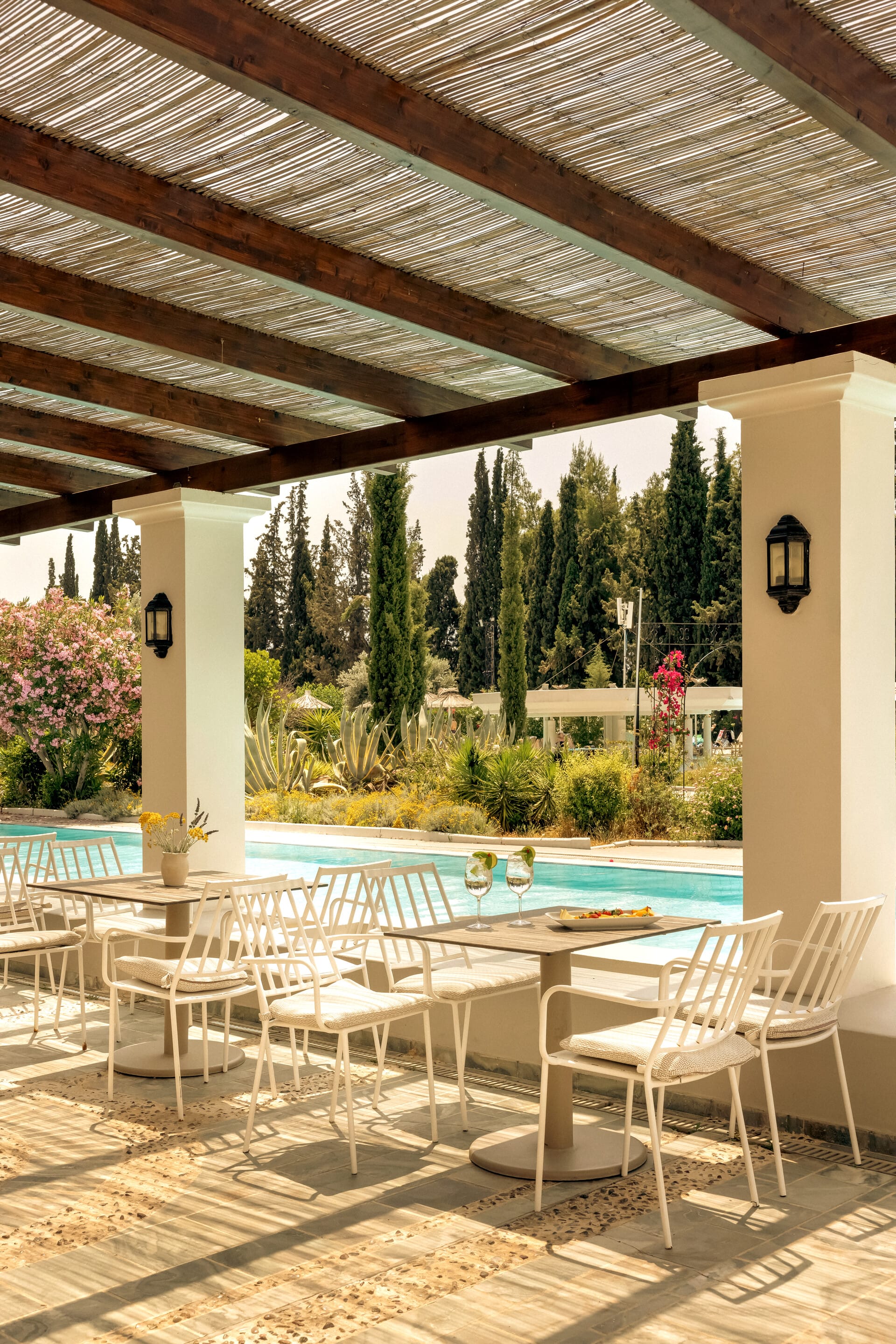 a pool with chairs around it