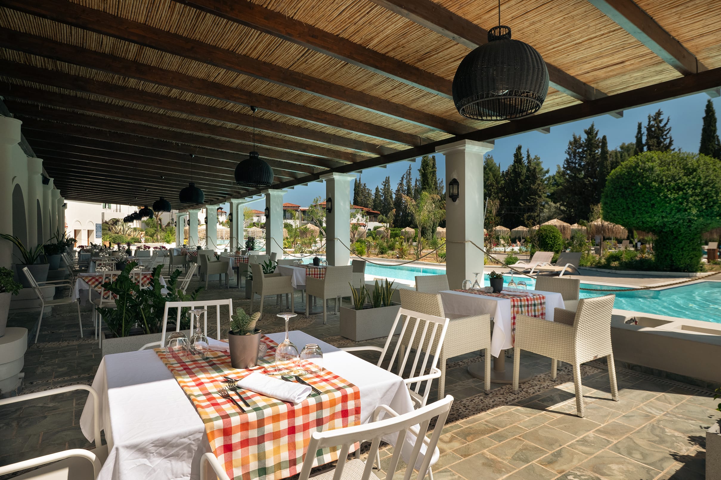 a patio with tables and chairs