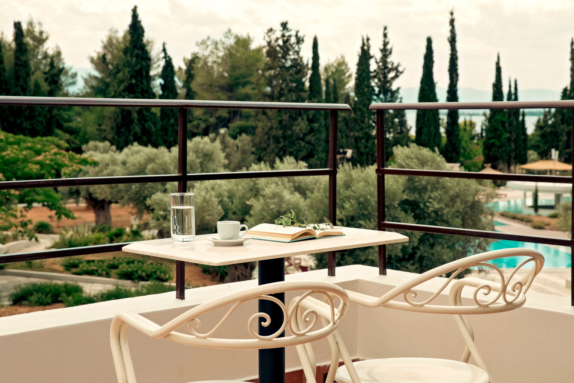 a table and chairs on a balcony