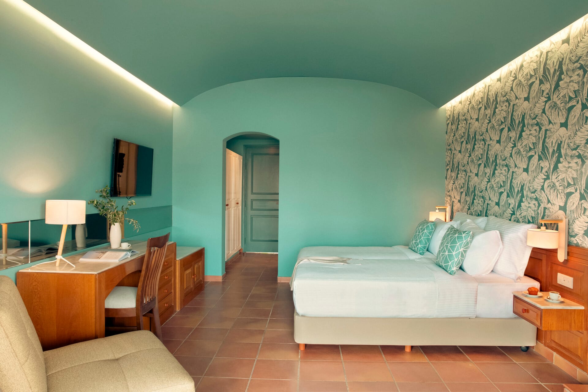 a room with a bed and a desk