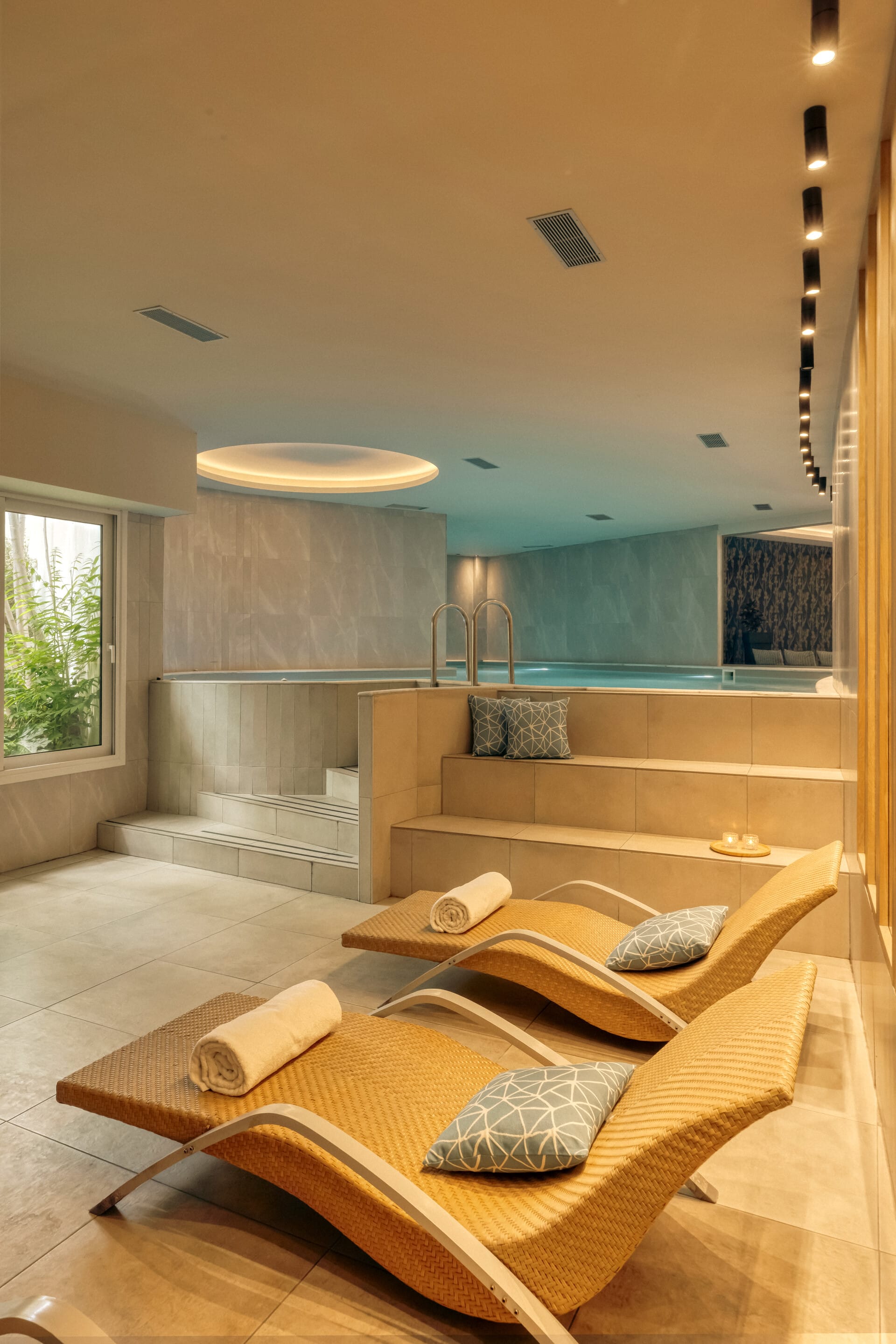 a large living room with a couch and a table