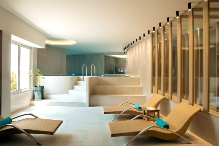 a room with a staircase and chairs