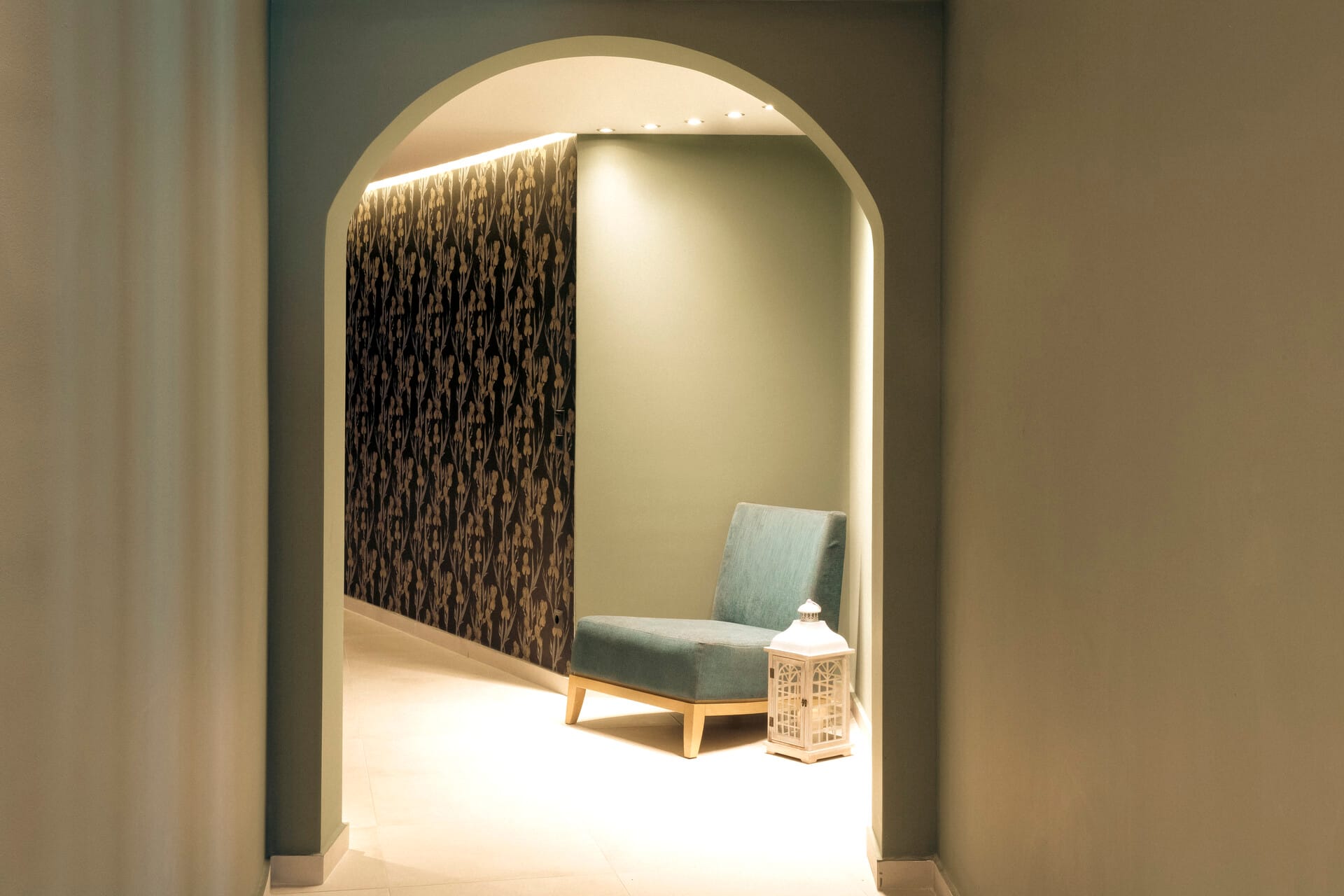 a room with a chair and a bottle of water