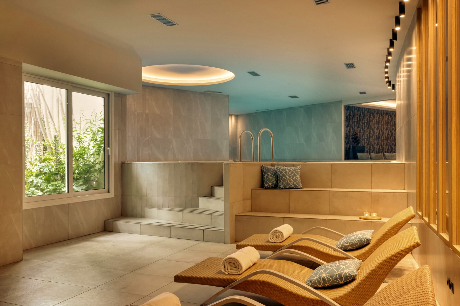 a bathroom with a tub and a bench