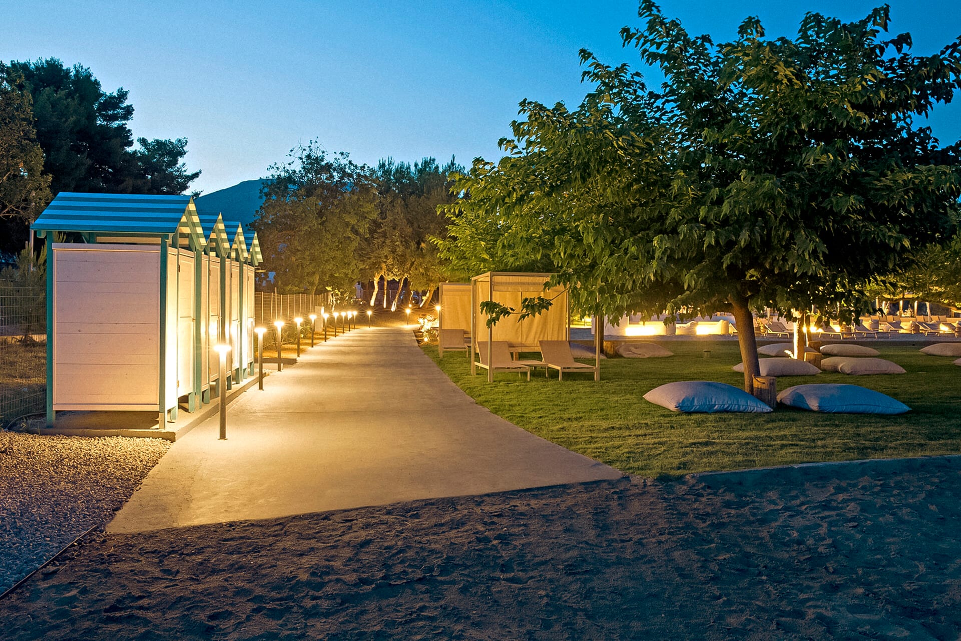 a building with a pool and trees