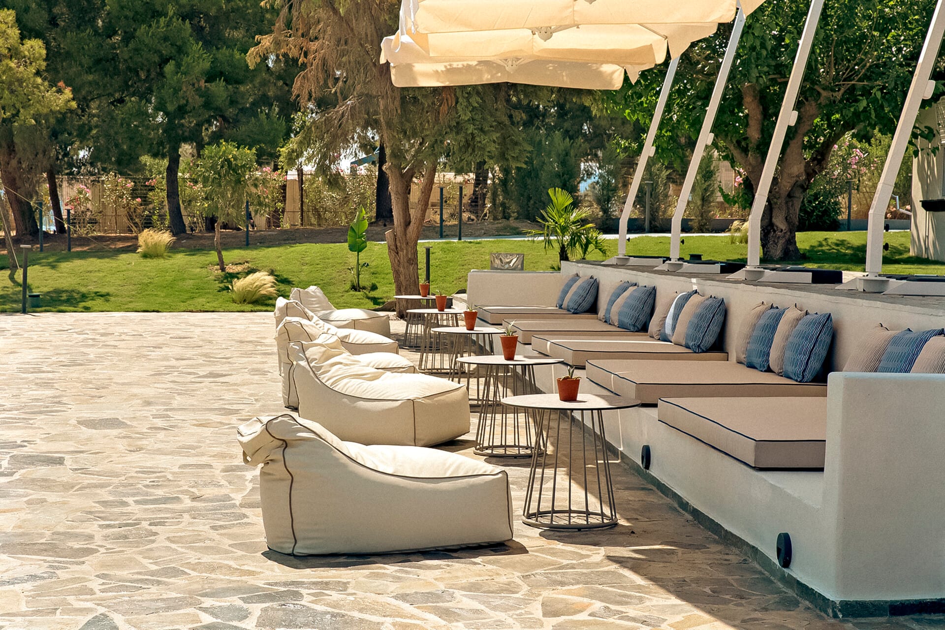 a lounge area with a table and chairs and a gazebo