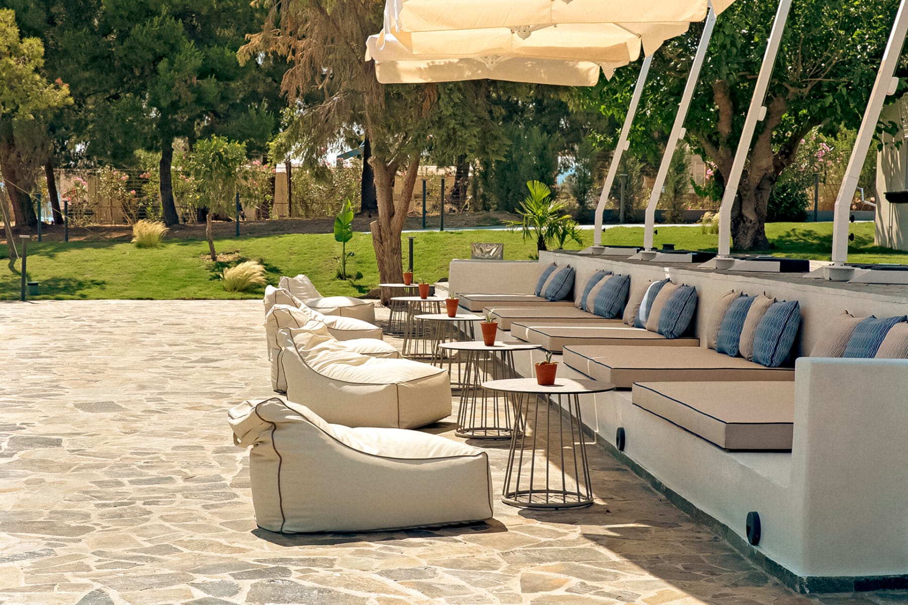 a lounge area with a table and chairs and a gazebo