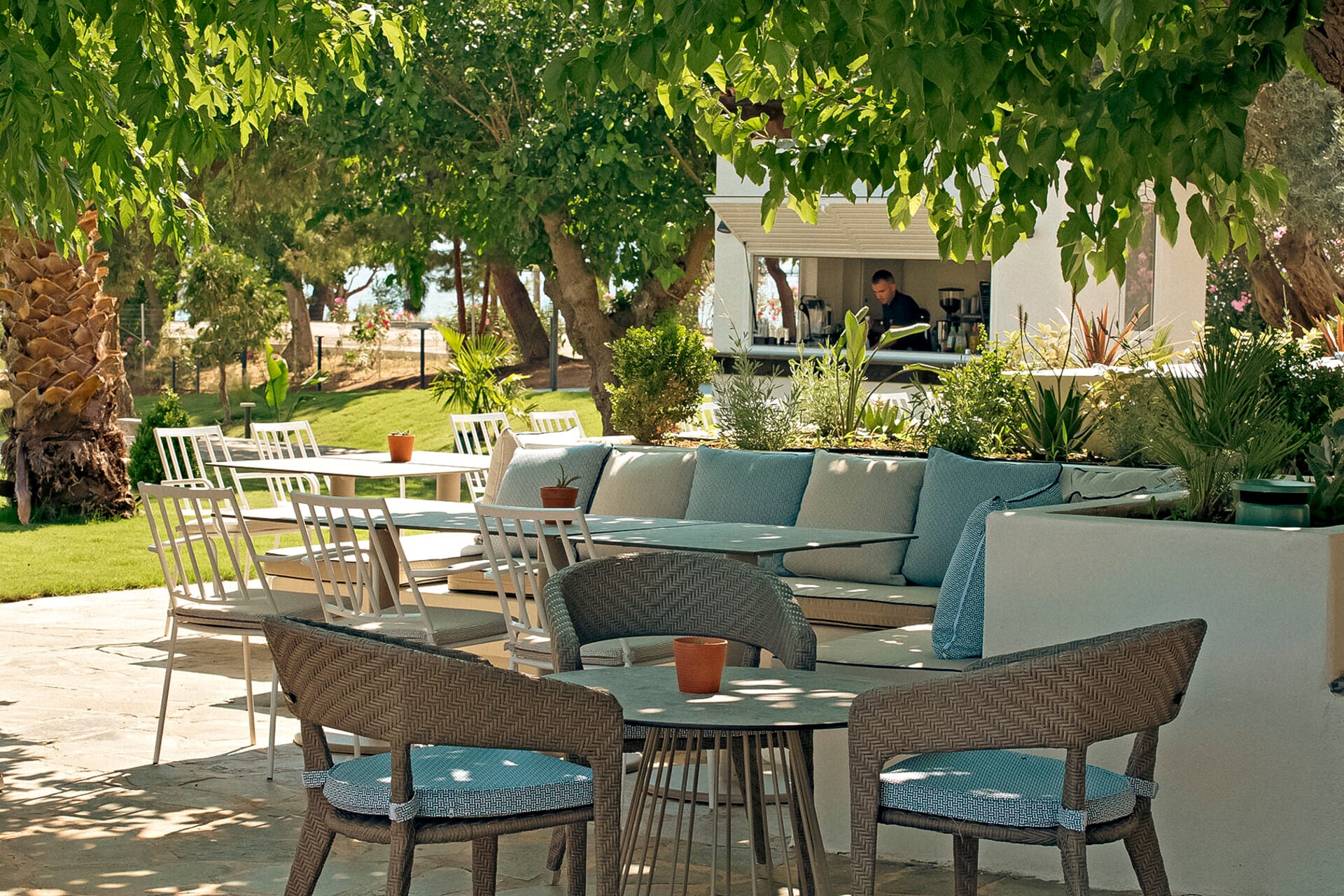 a patio with tables and chairs