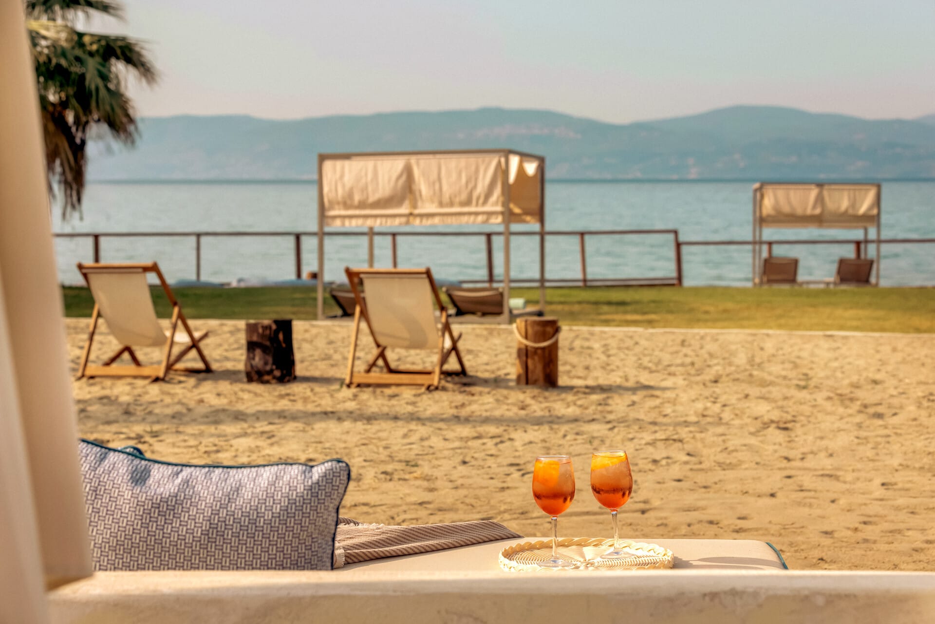 a table and chairs on a beach