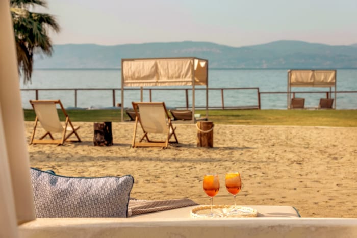 a table and chairs on a beach