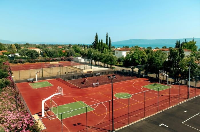 a sports field with a red track