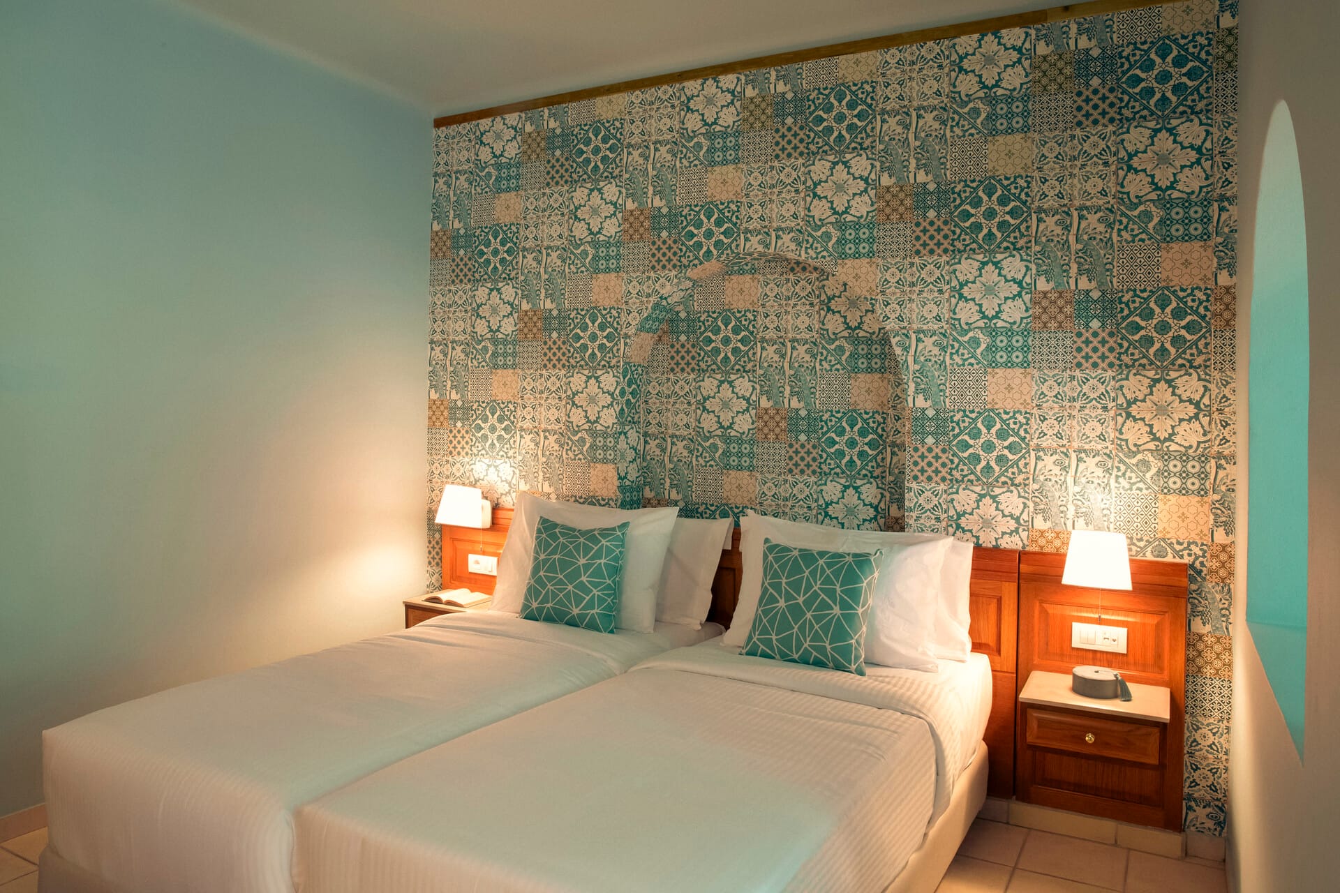 a bed with a wallpaper